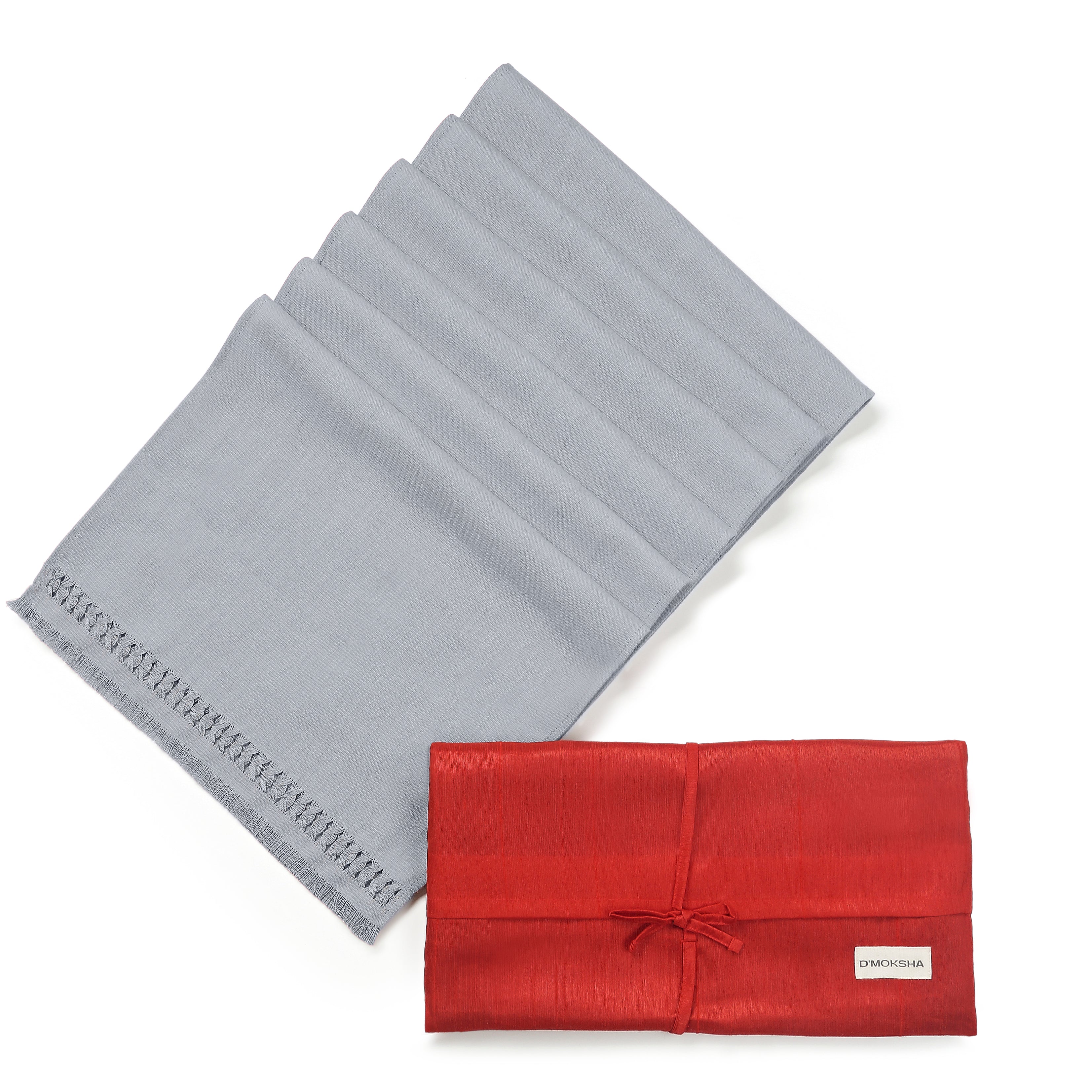 Light grey faux linen dinner napkins folded to show fabric texture