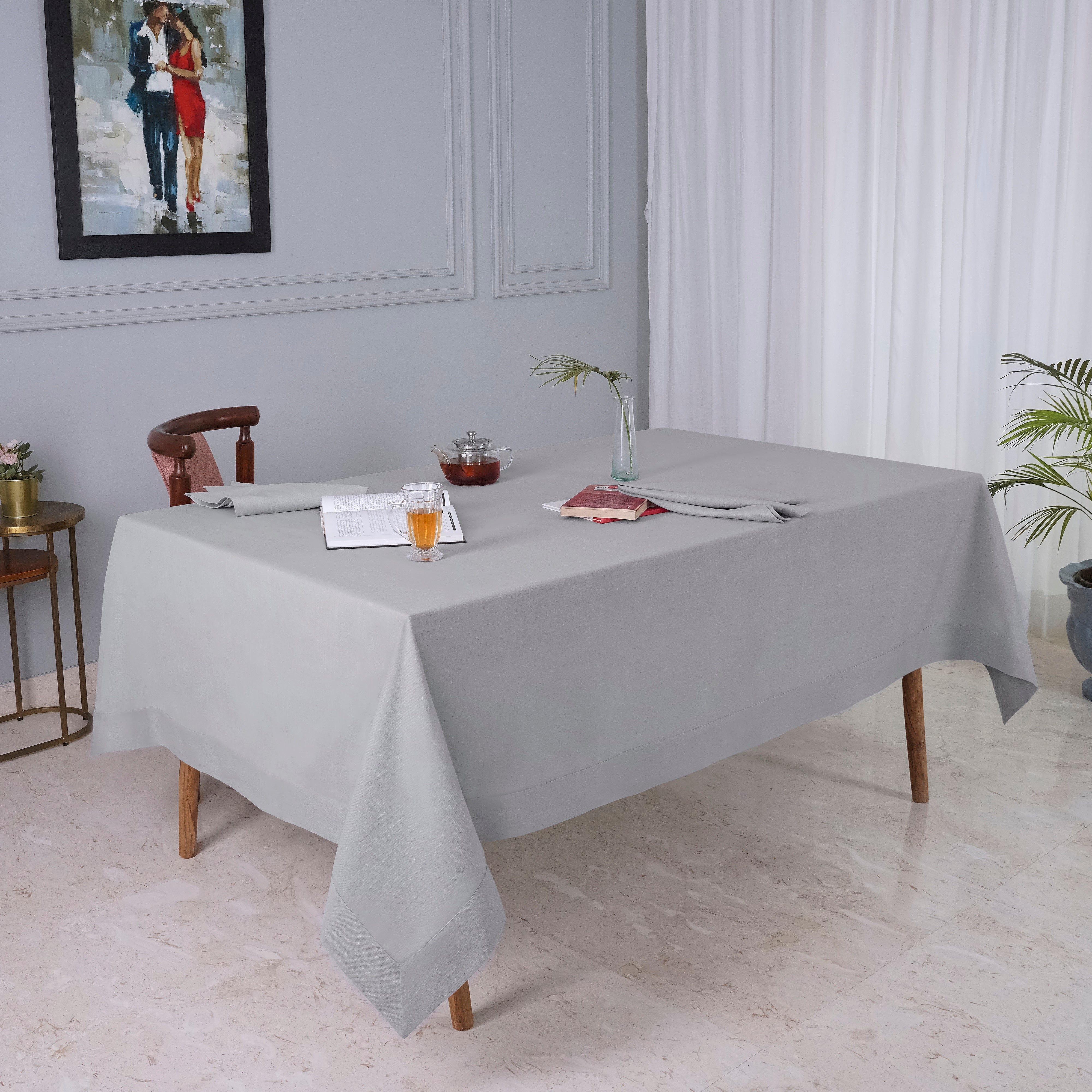 Light grey faux linen tablecloth in a set table setting