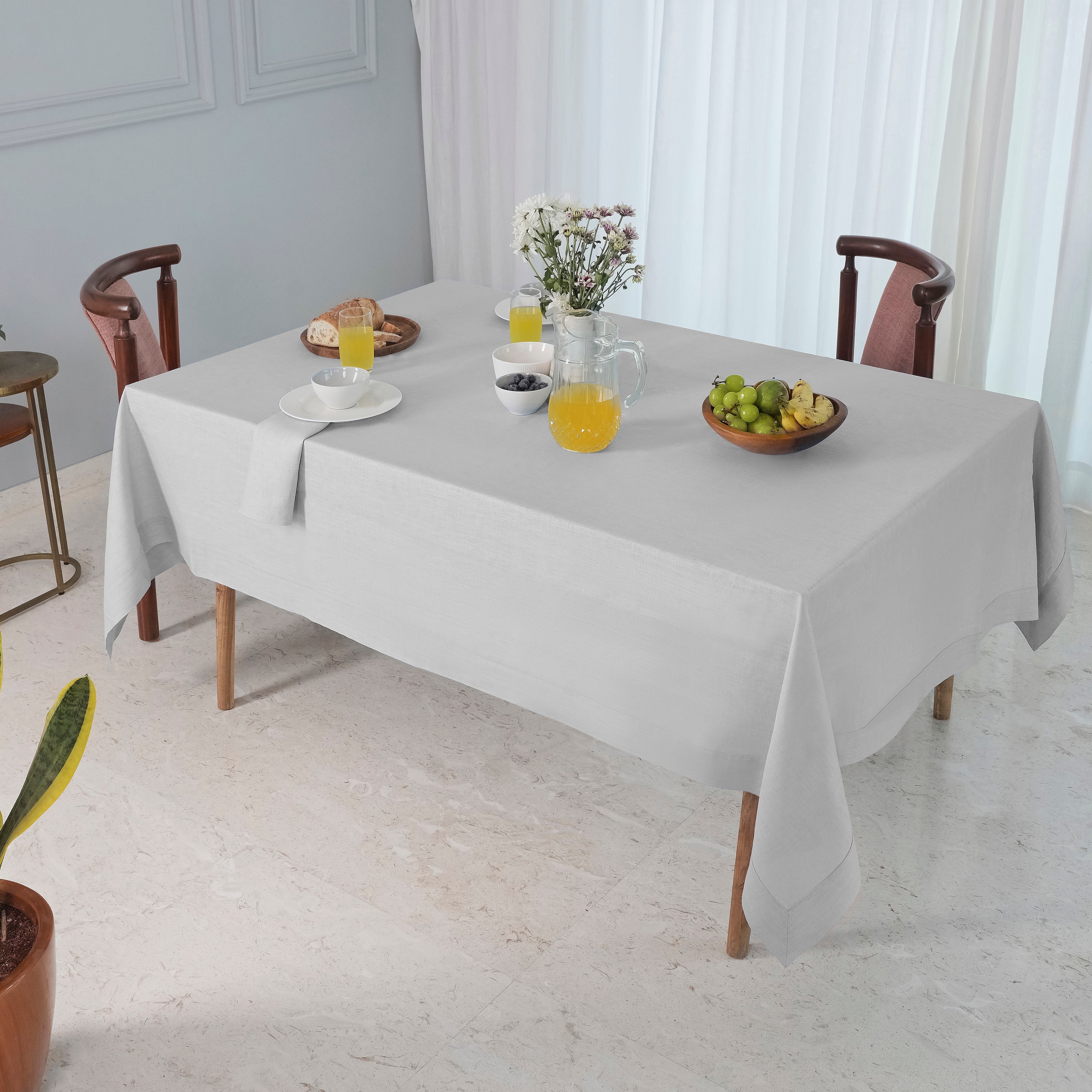 Silver grey pure linen tablecloth in a set table setting