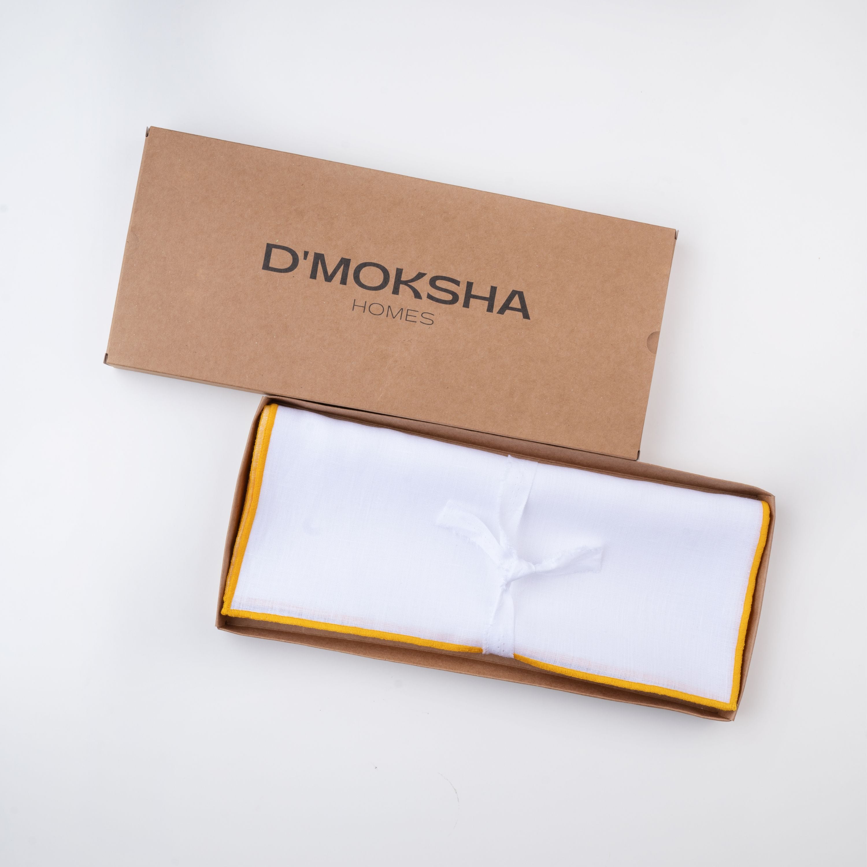 White and yellow pure linen placemats in a set table setting