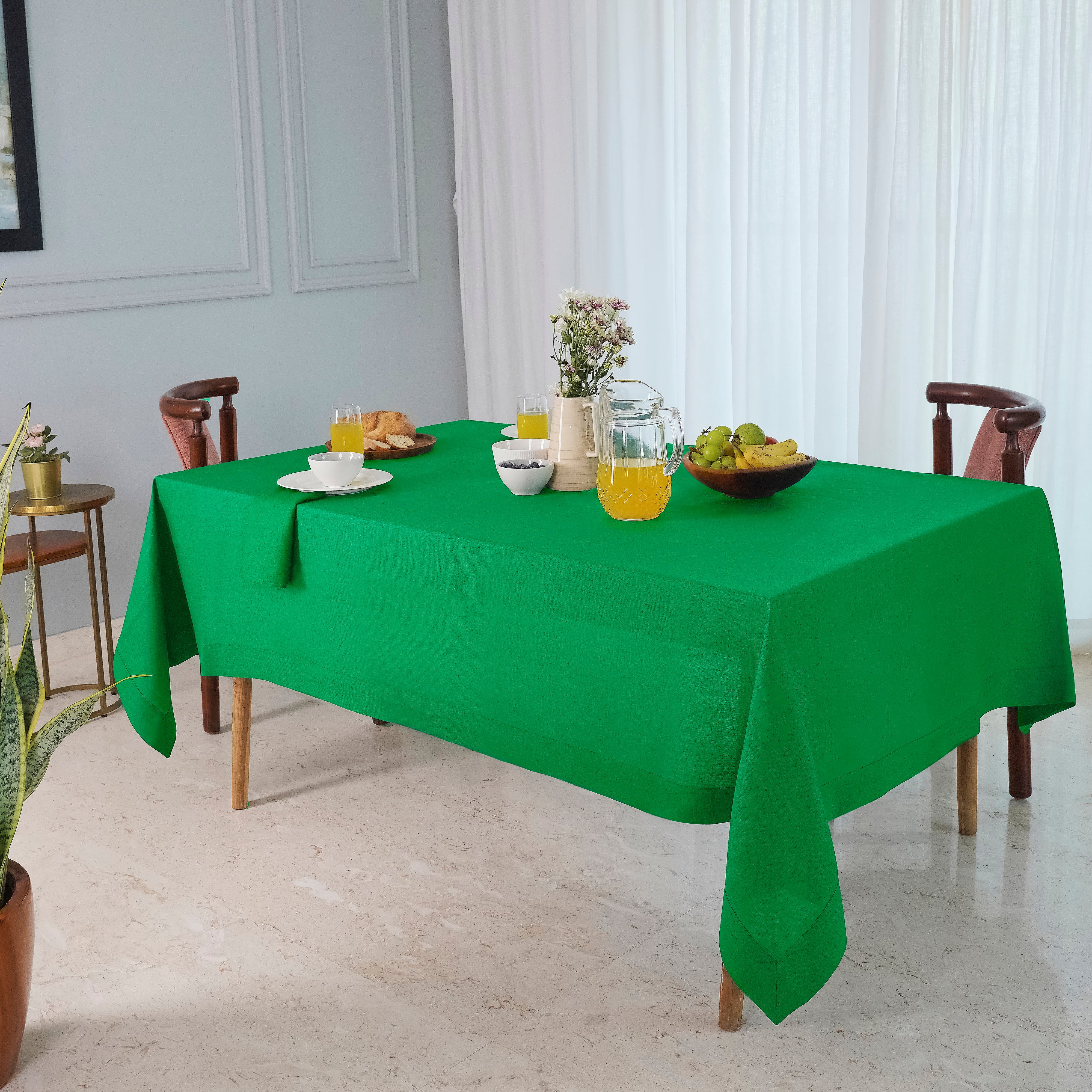 Kelly green pure linen tablecloth in a set table setting