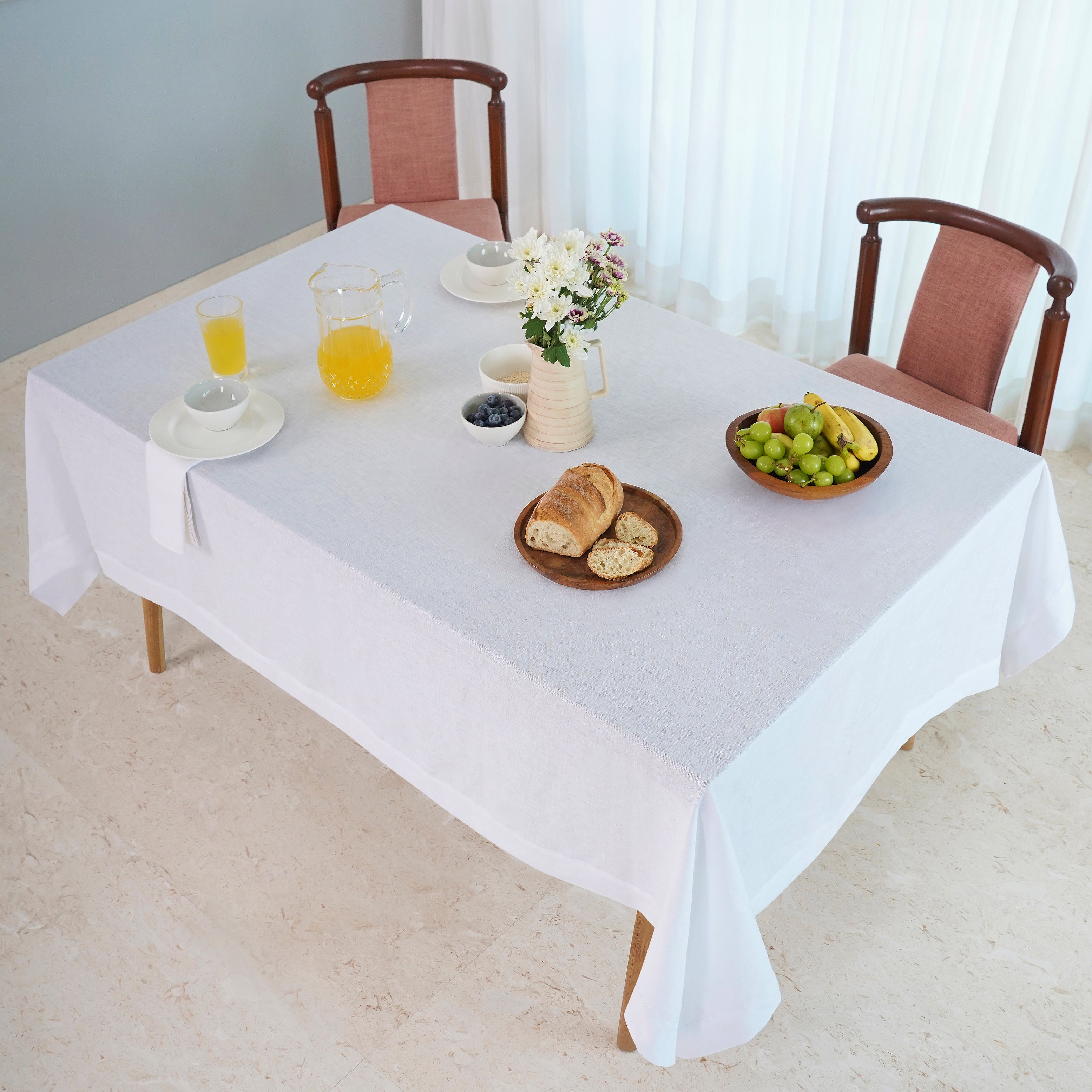 White linen tablecloth in a set table setting