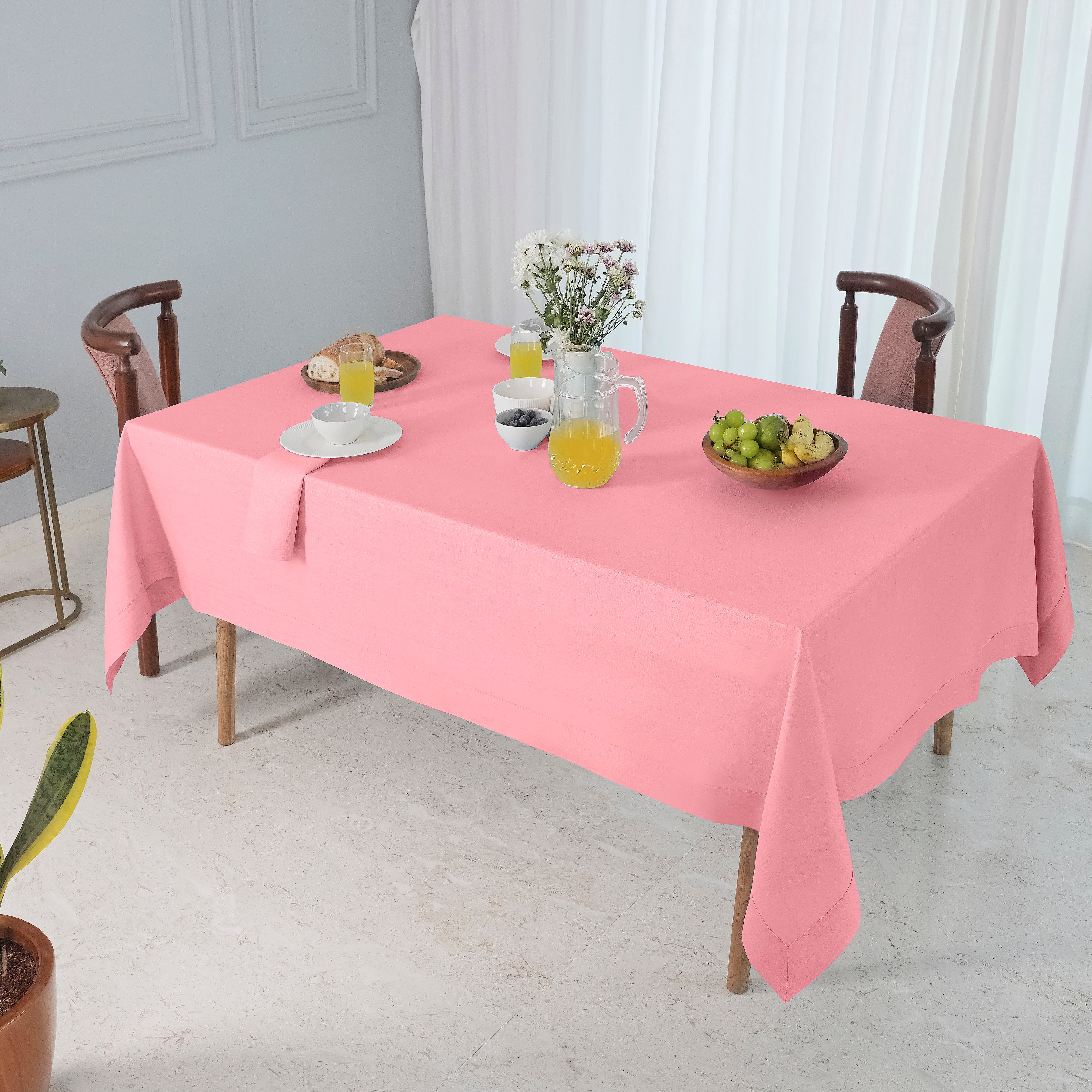 Dusty pink pure linen tablecloth in a set table setting