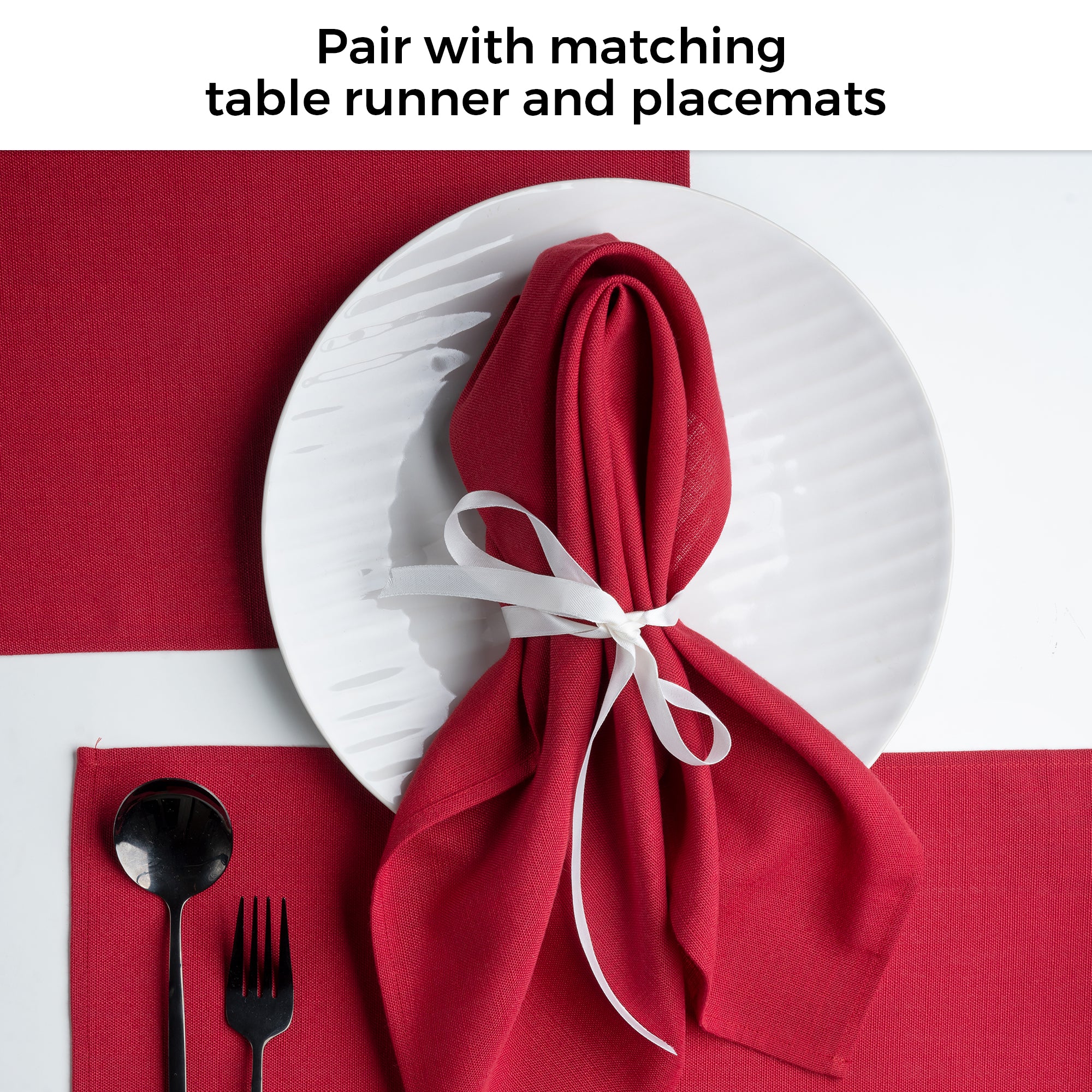 Red faux linen placemats in a set table setting