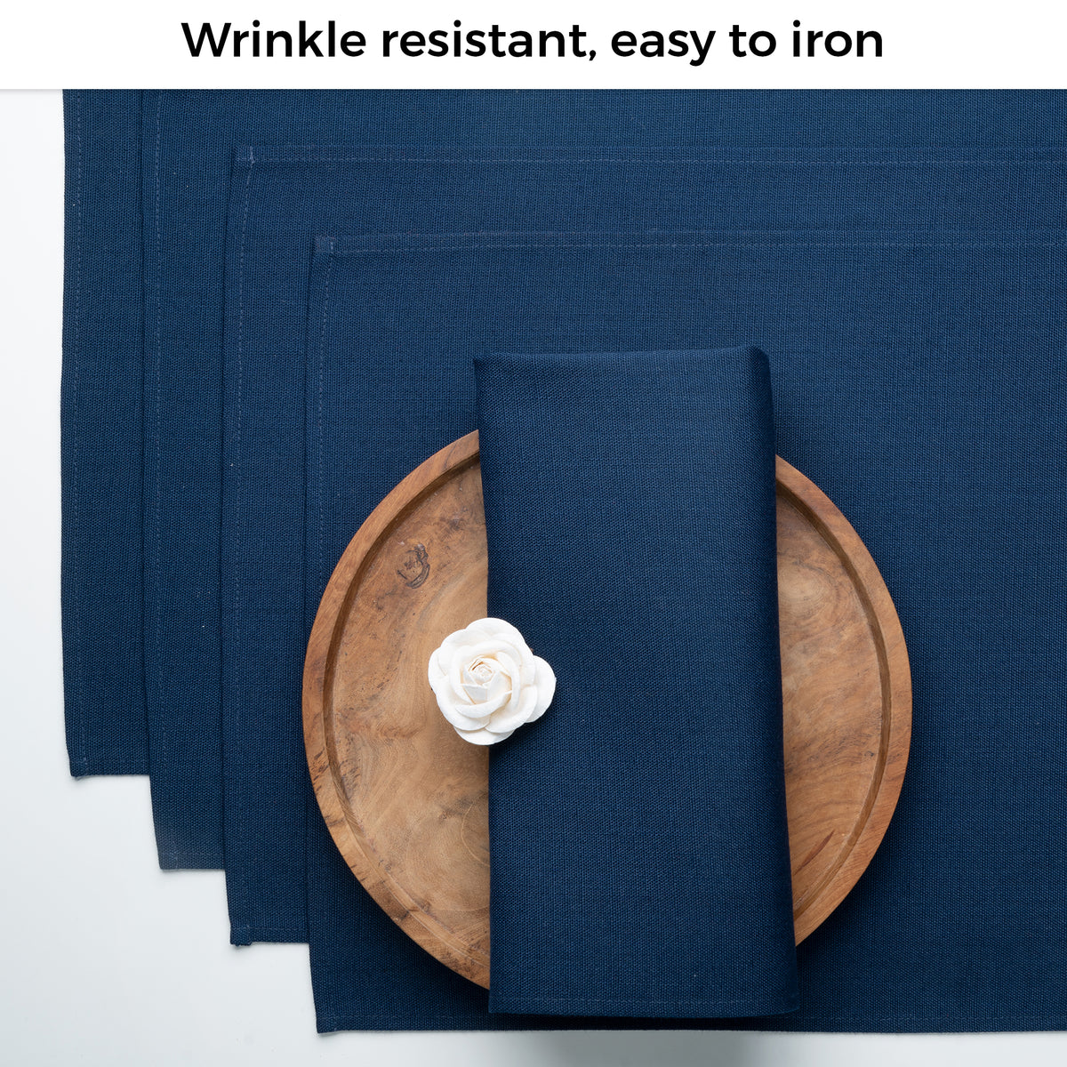 Navy blue faux linen dinner napkins folded to show fabric texture