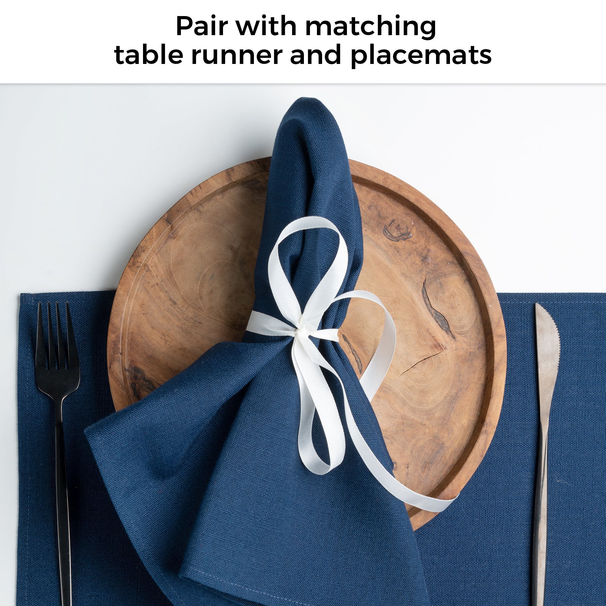 Navy blue faux linen placemats in a set table setting