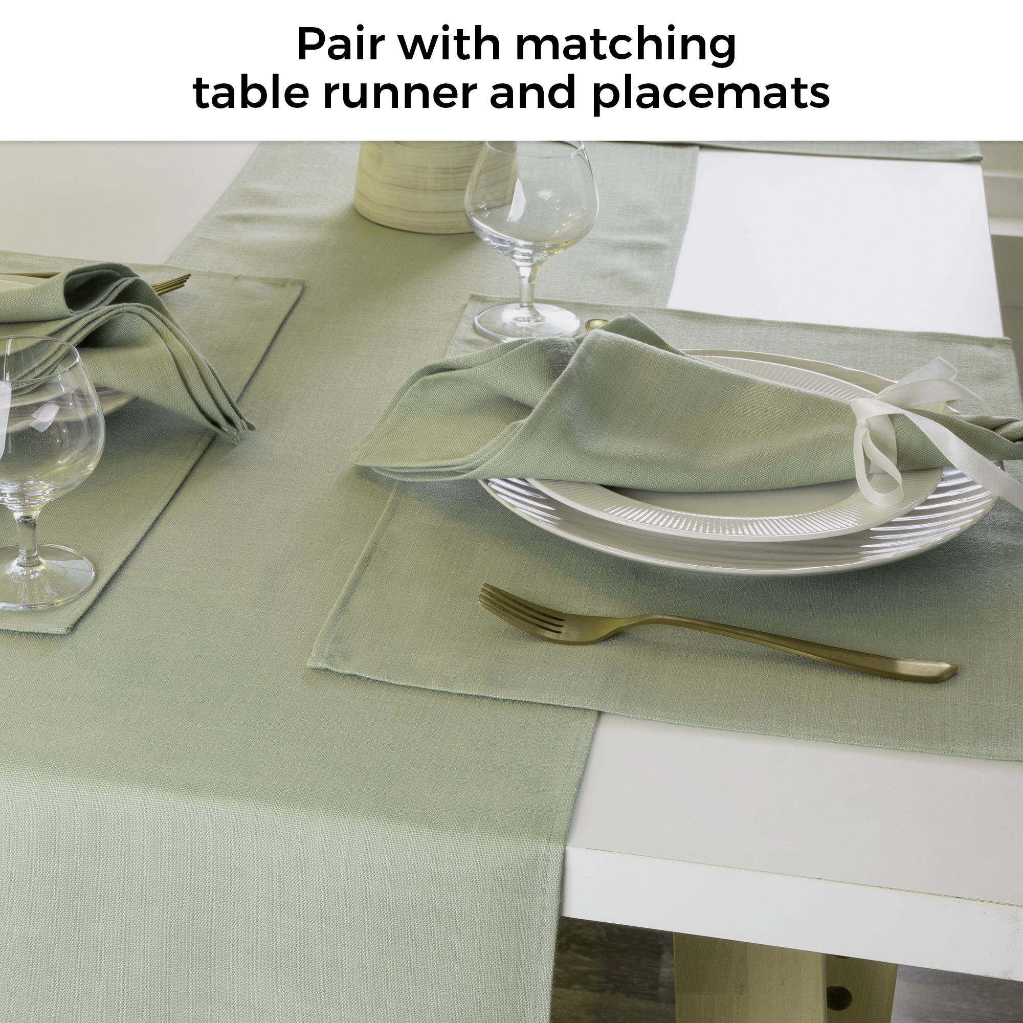 Sage green faux linen placemats in a set table setting