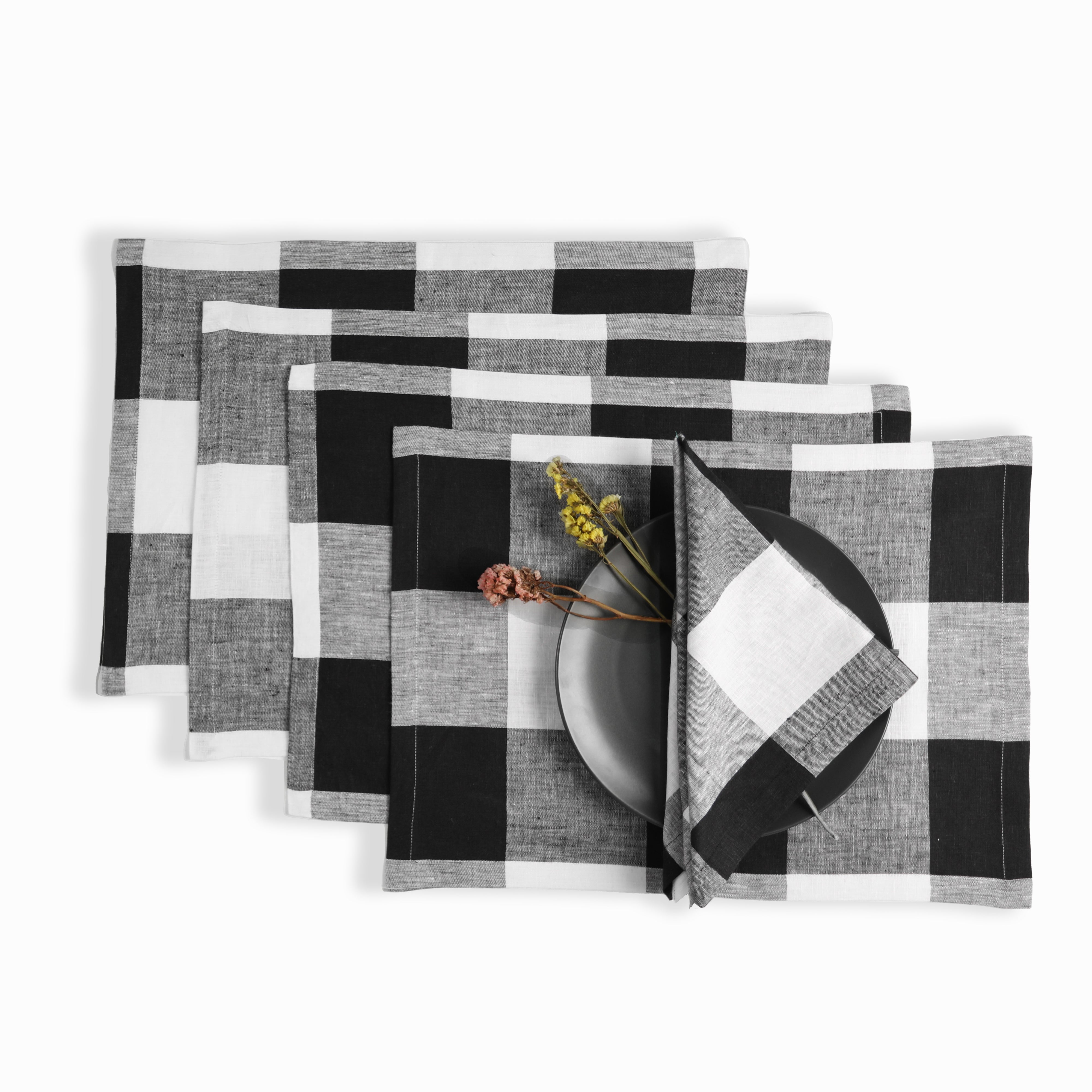 White and black pure linen dinner napkins styled on a dining table