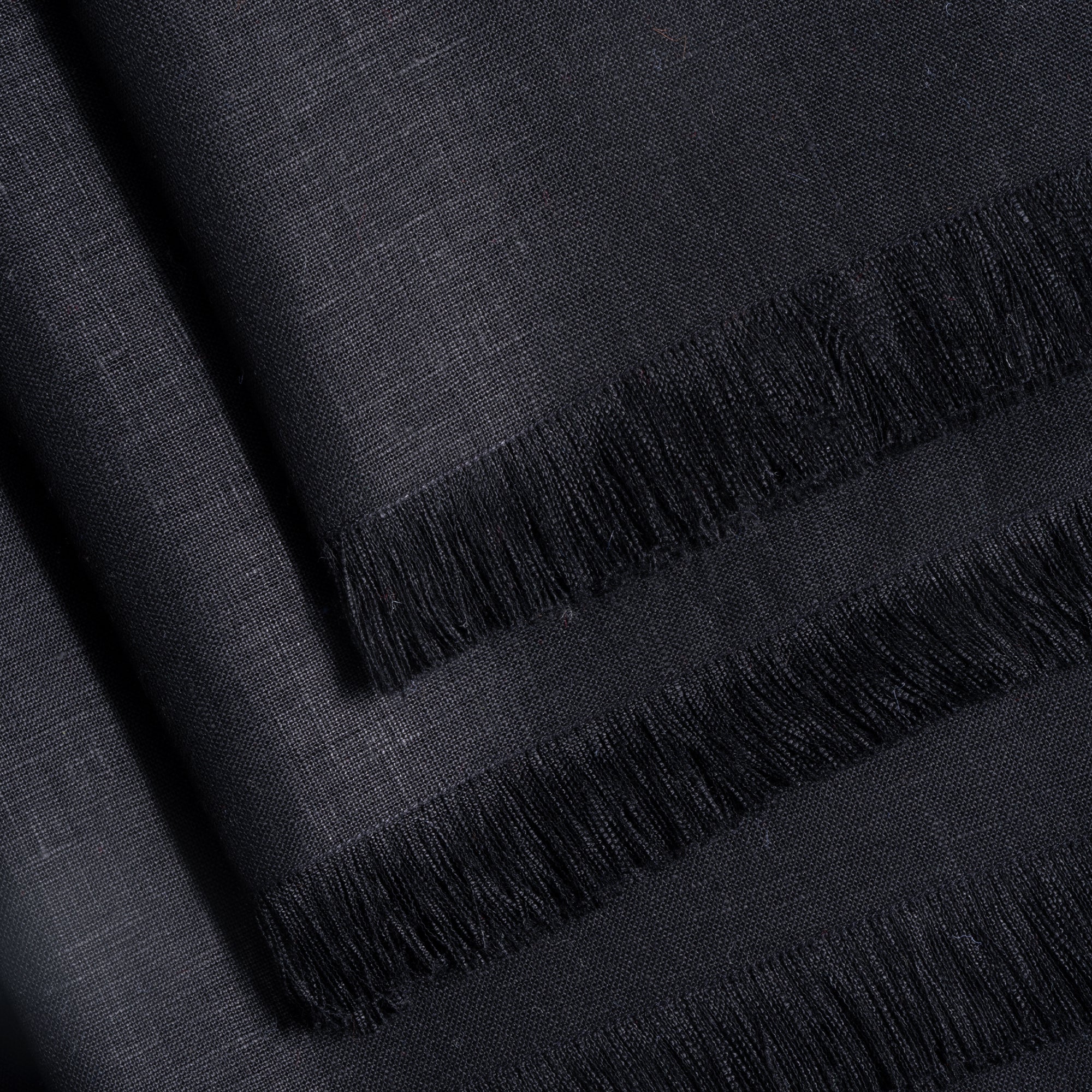 Black pure linen dinner napkins folded to show fabric texture