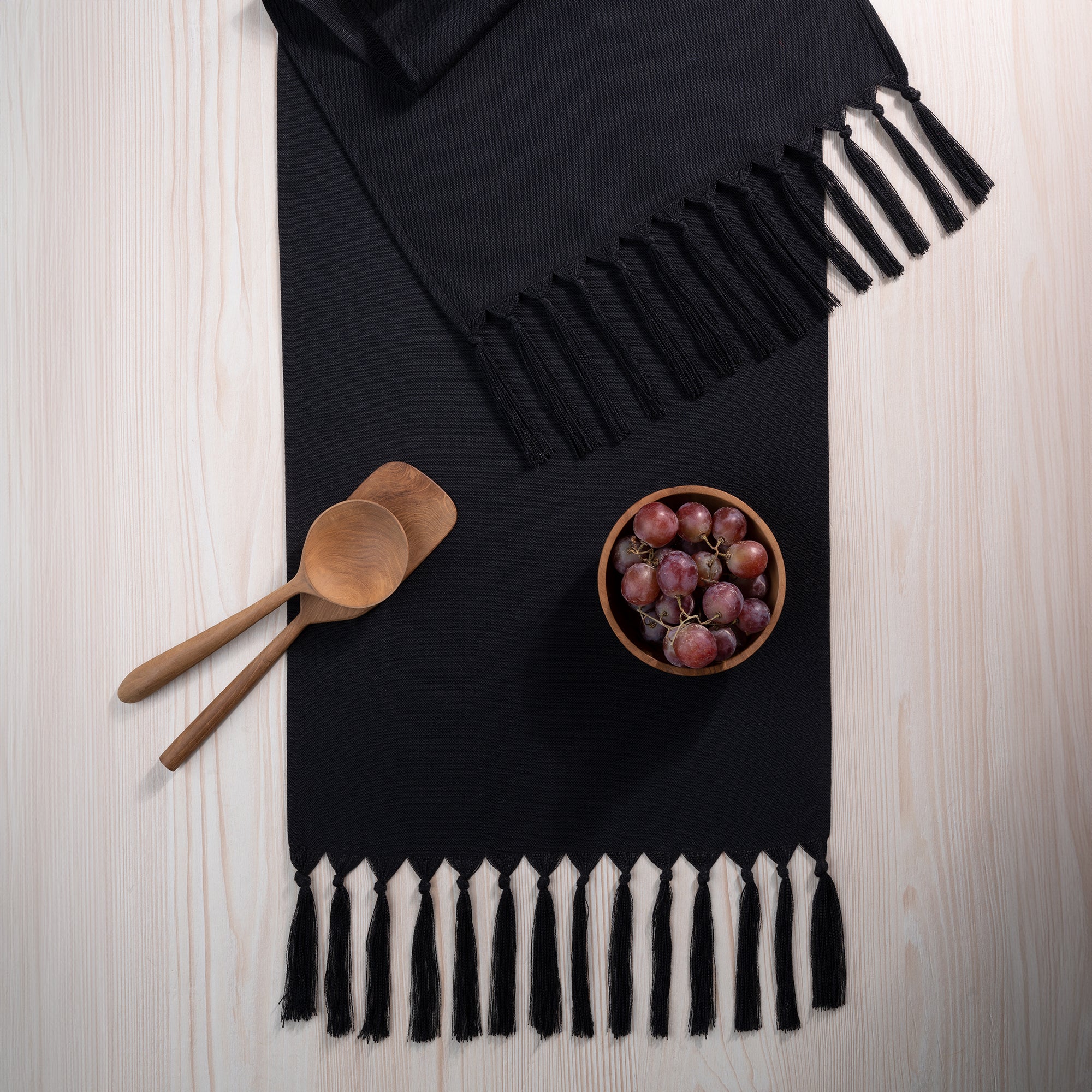 Black faux linen table runner with matching D'Moksha table linens
