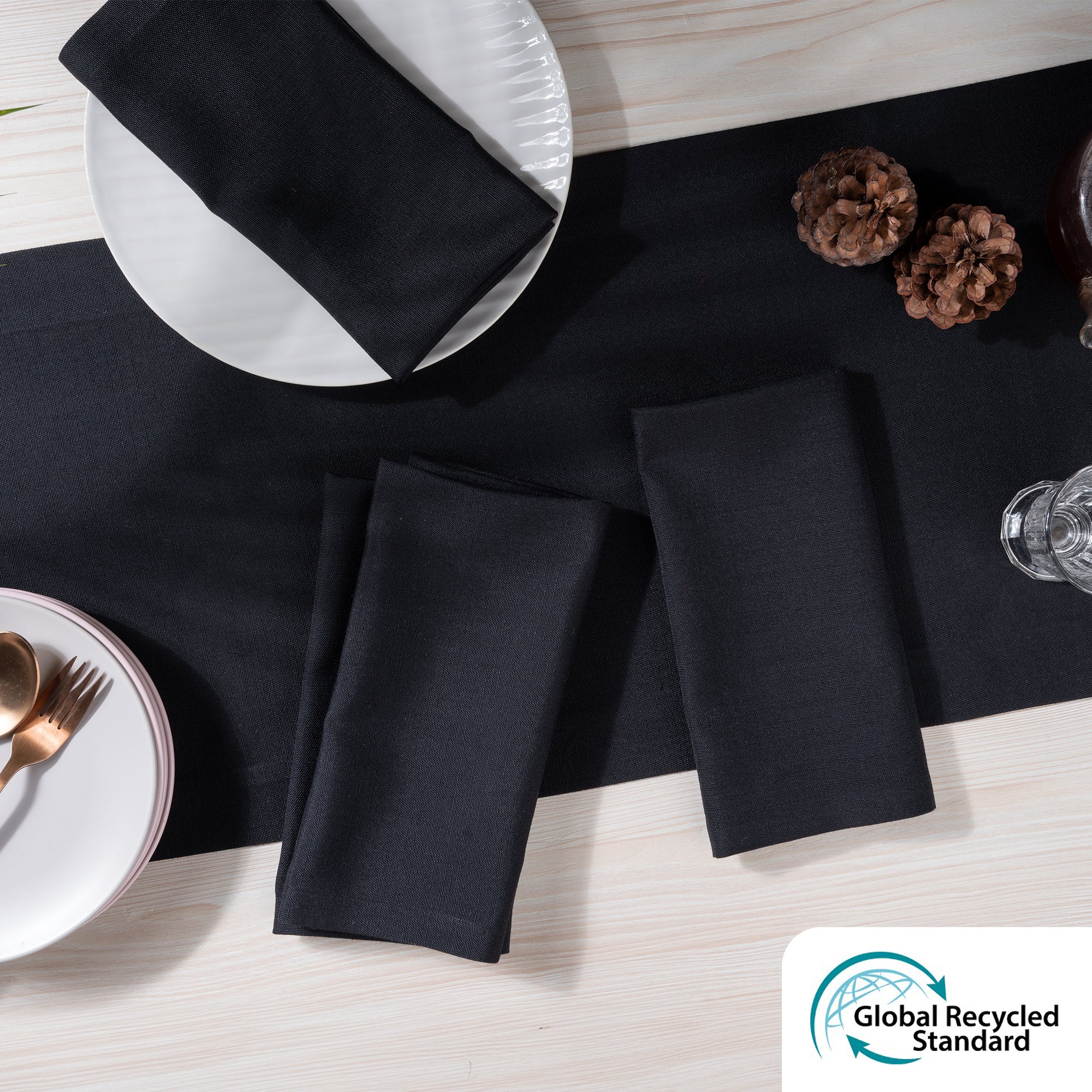 Black faux linen dinner napkins styled on a dining table
