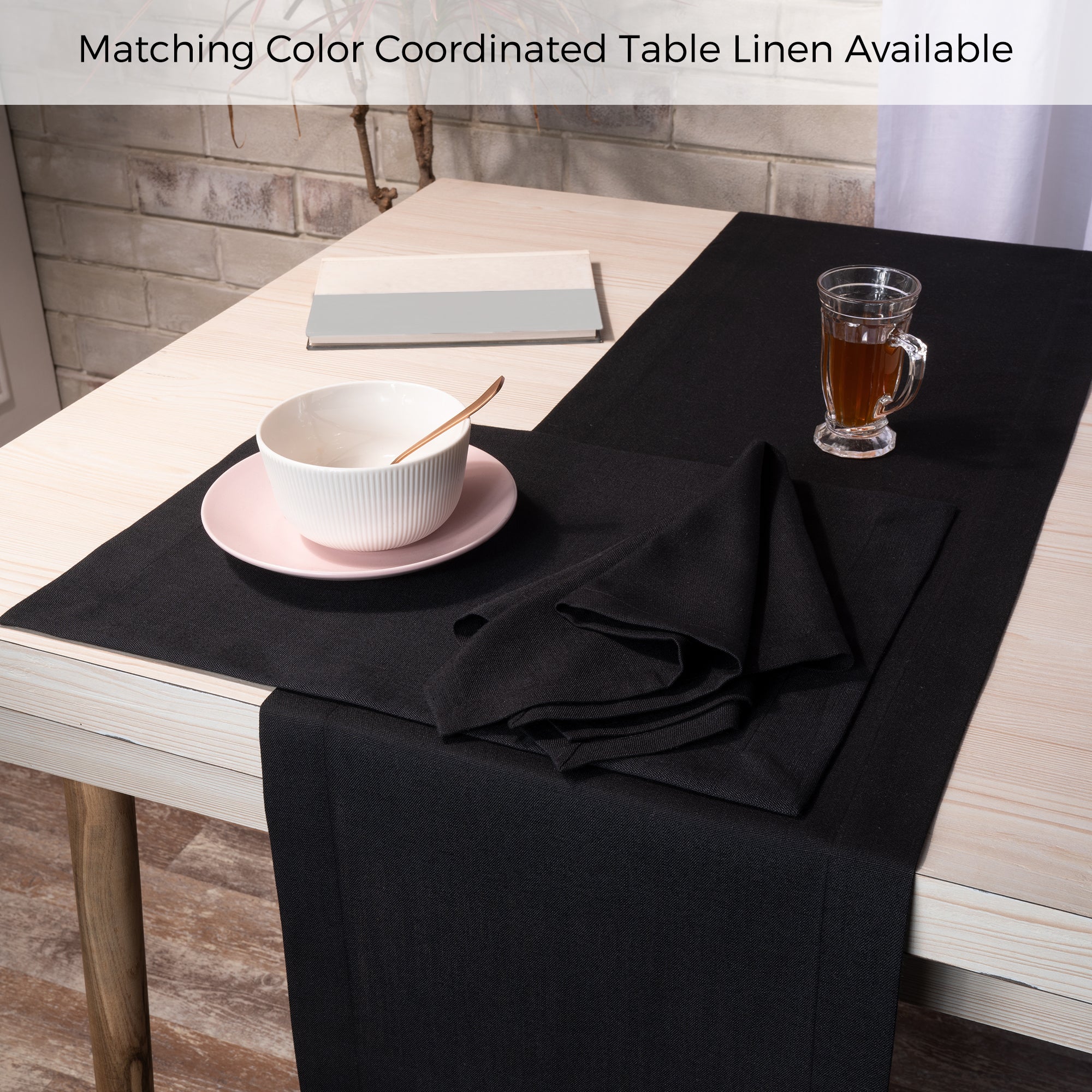 Black faux linen dinner napkins folded to show fabric texture