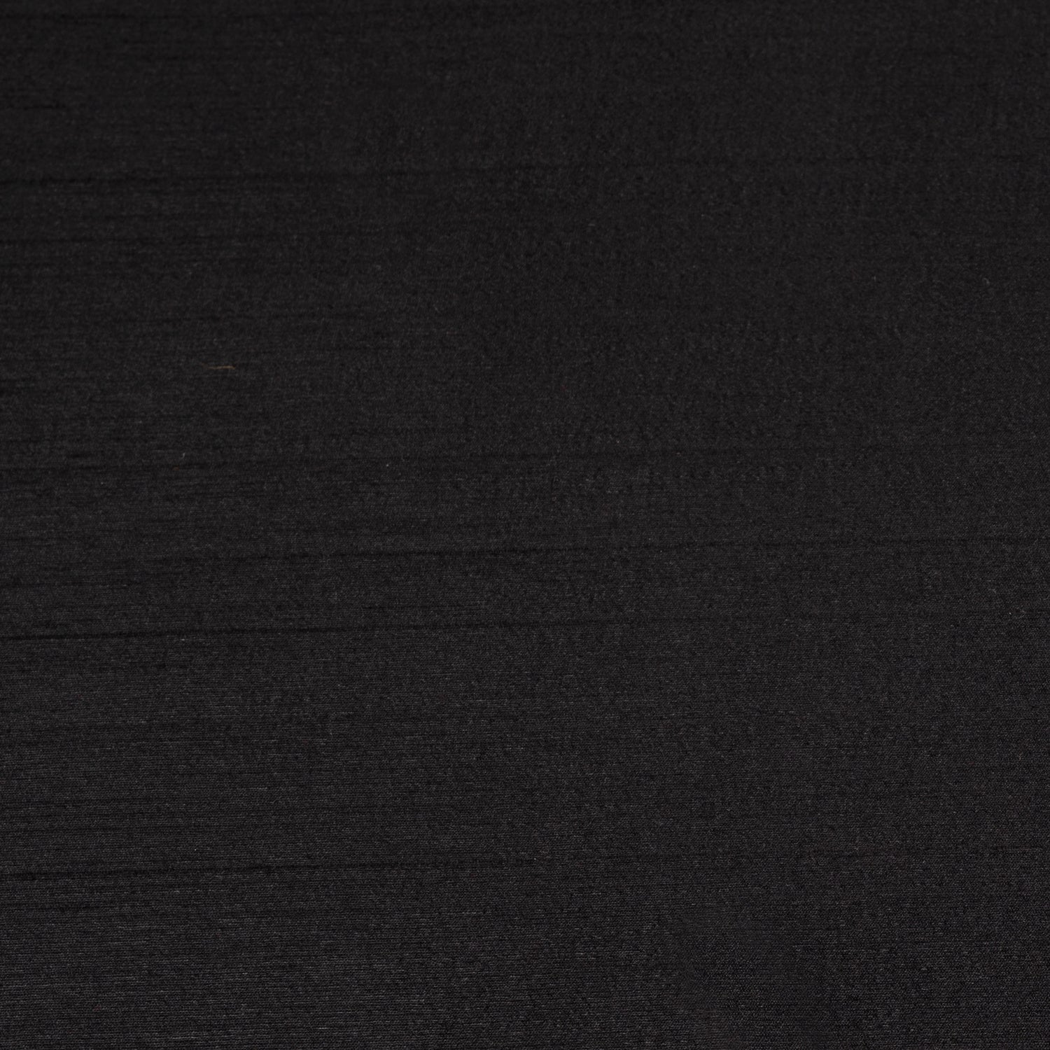 Black Luxe Shine tablecloth styled on a dining table