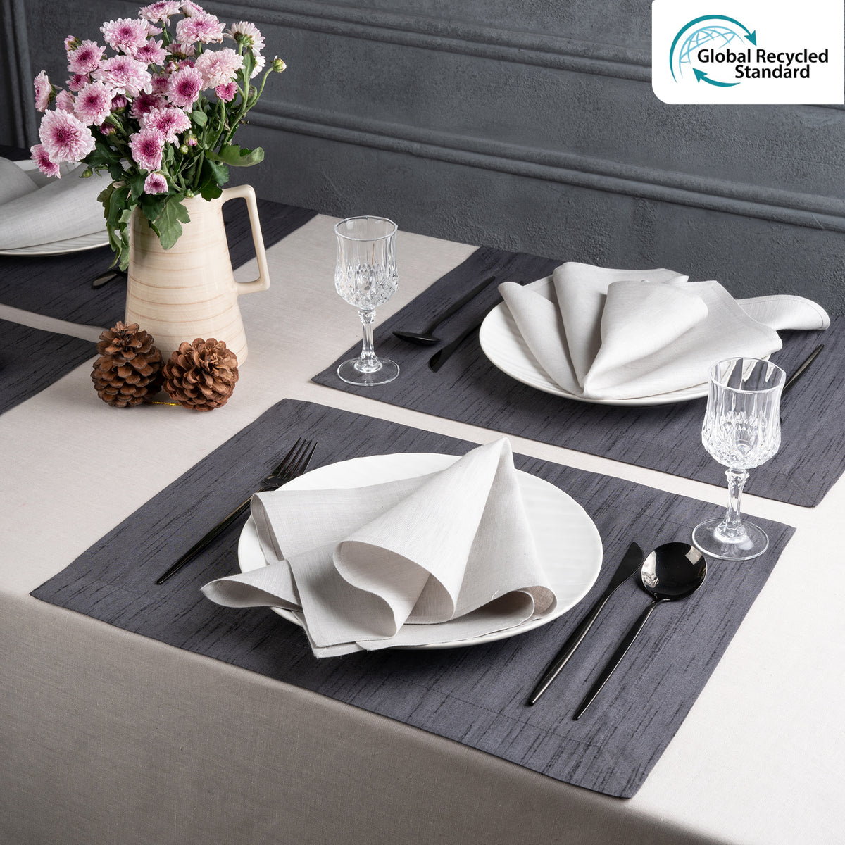 Charcoal grey Luxe Shine placemats styled on a dining table
