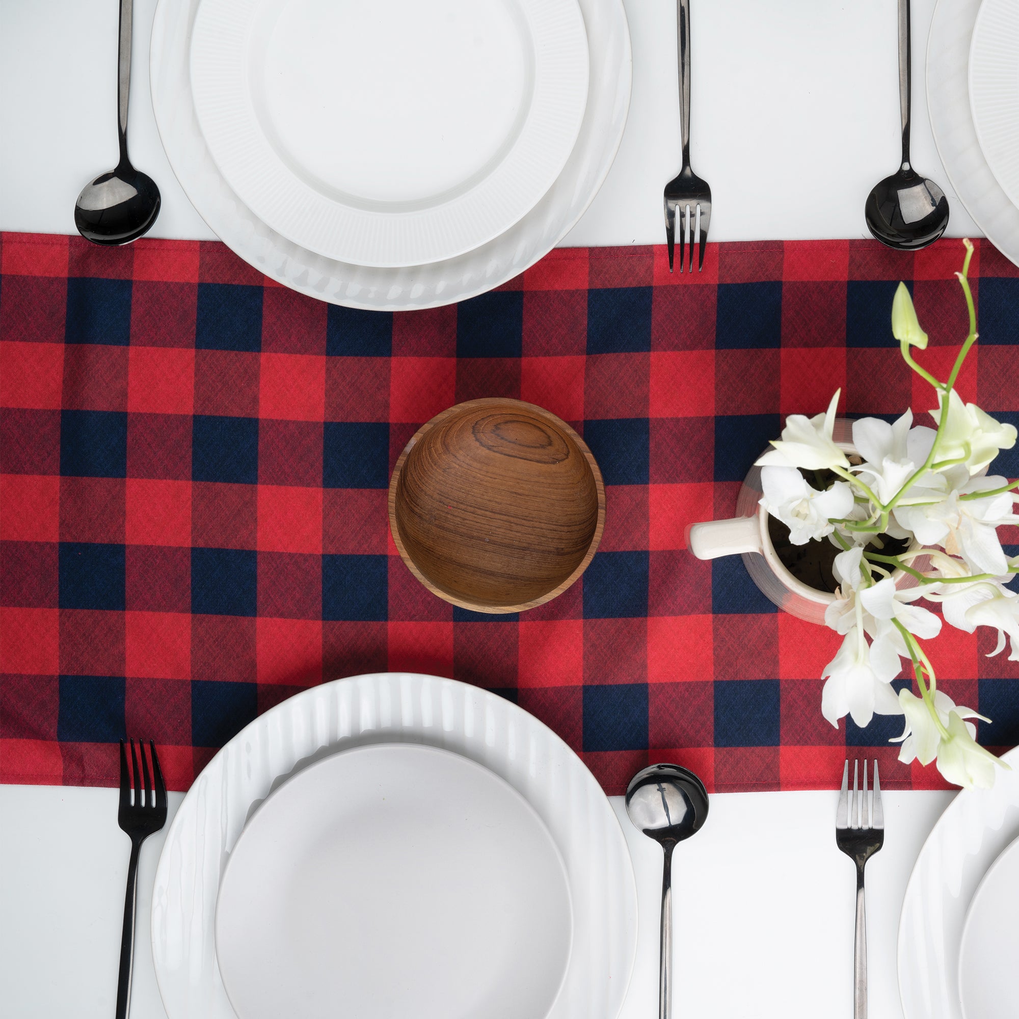 Red and navy blue linen table runner with matching D'Moksha table linens