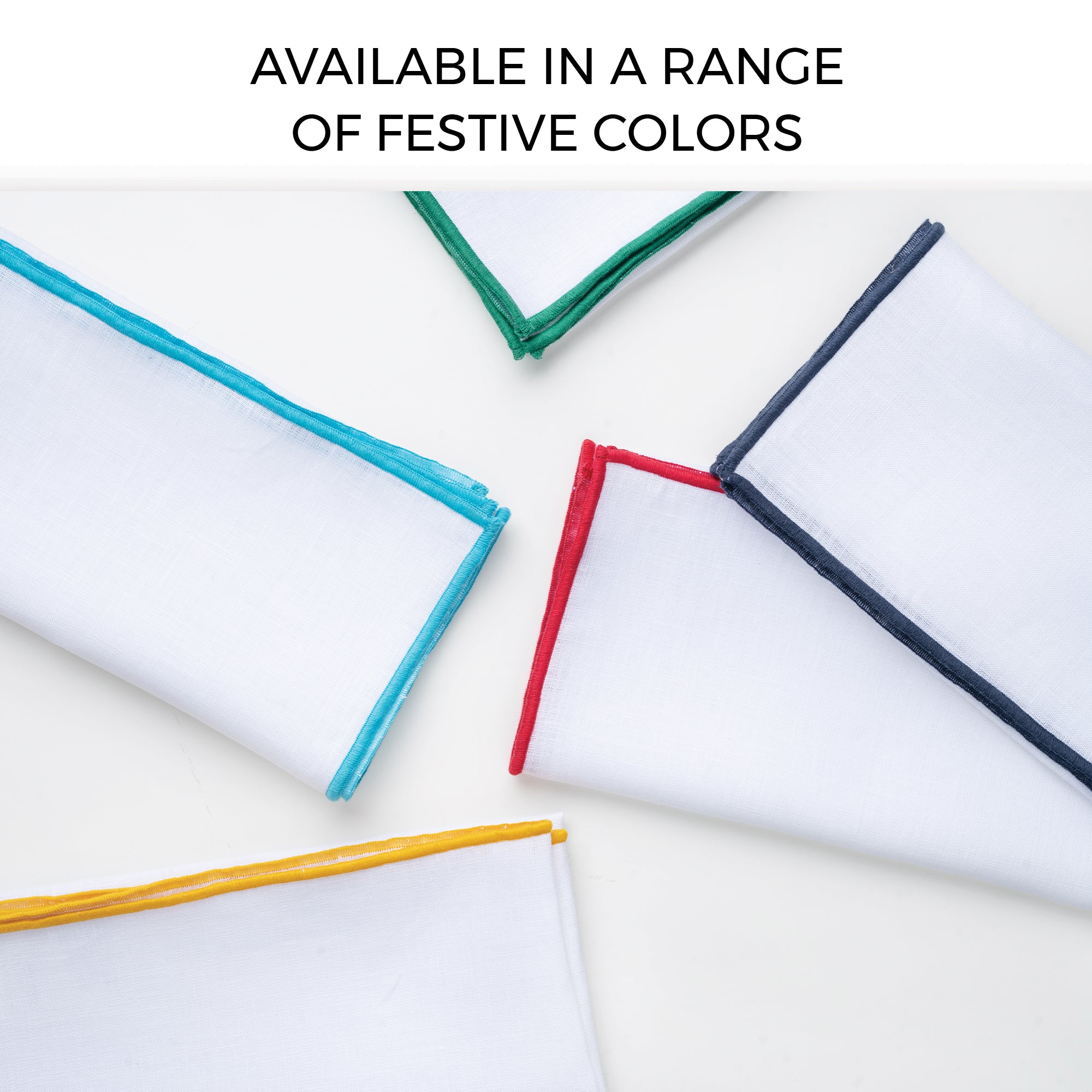 White and navy blue pure linen dinner napkins folded to show fabric texture