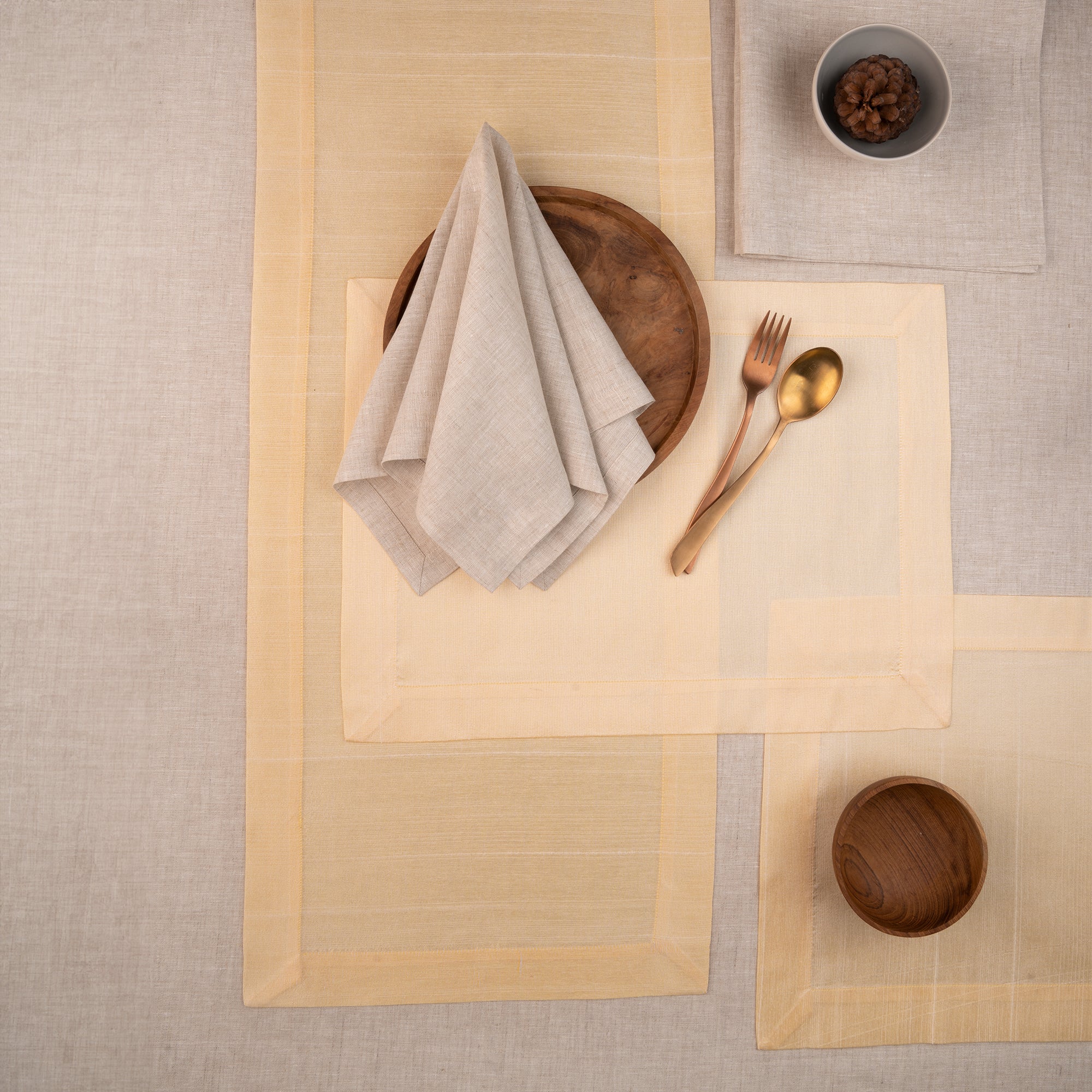 Cream Luxe Shine table runner with matching D'Moksha table linens