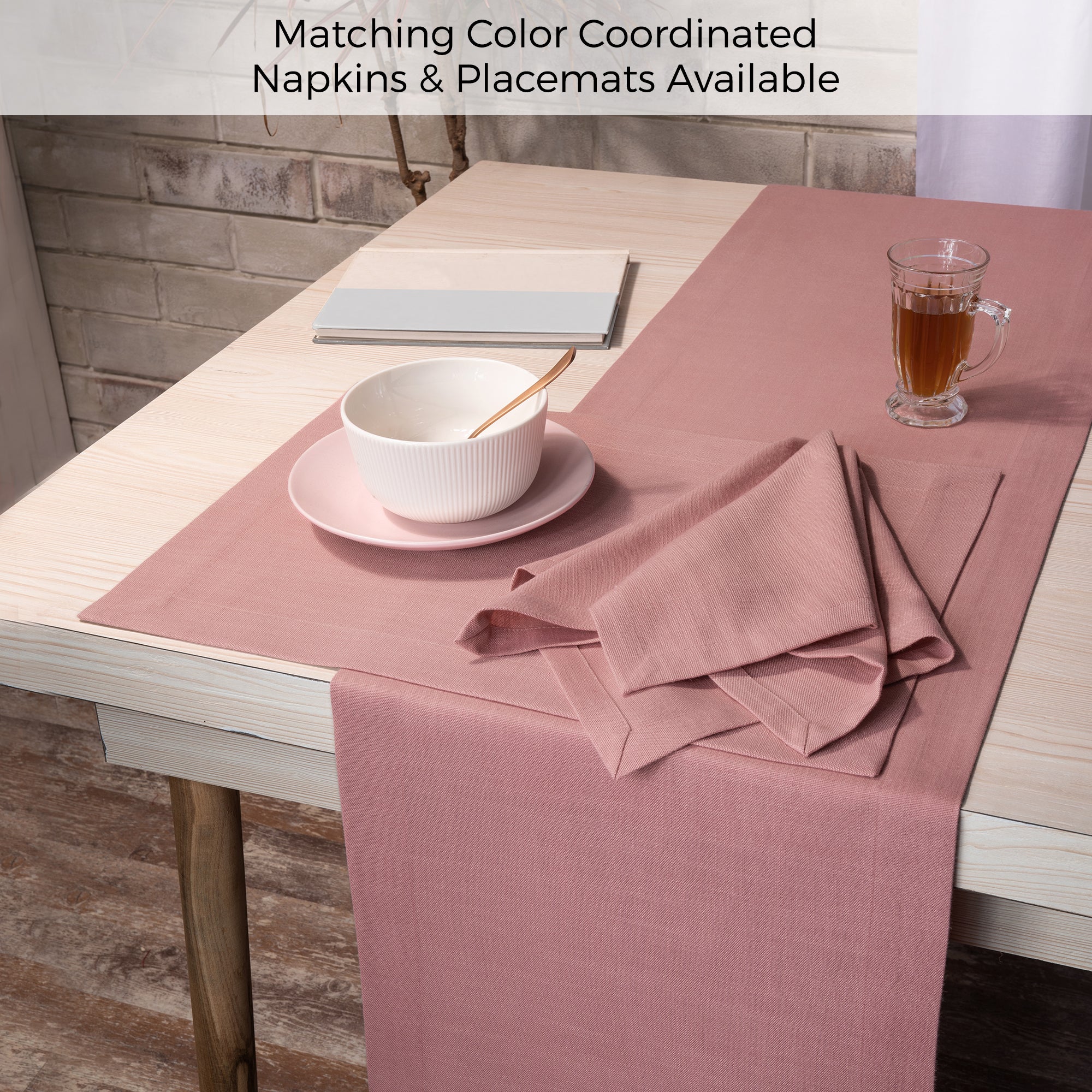 Dusty pink faux linen table runner folded to show fabric texture