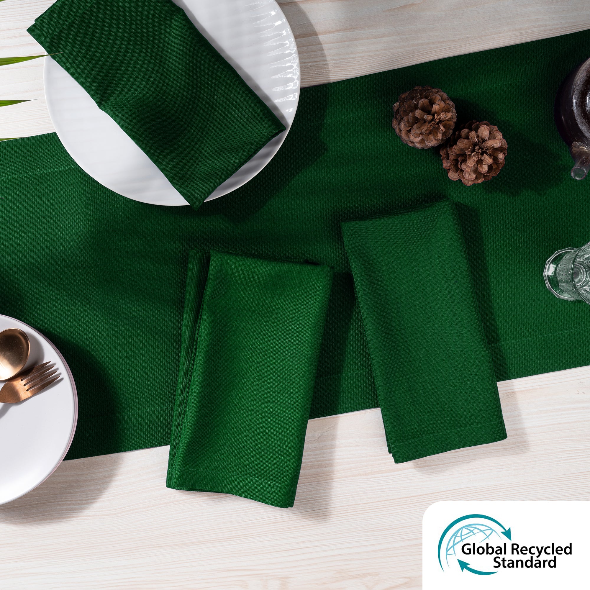 Eden green faux linen dinner napkins styled on a dining table