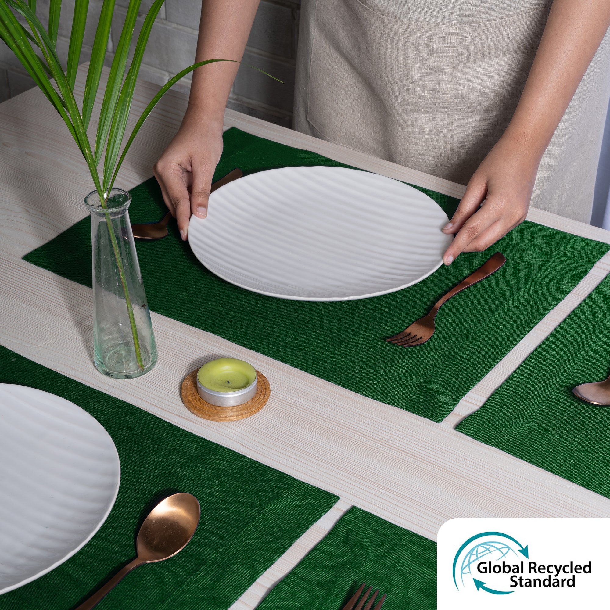 Close-up of the mitered corners on eden green faux linen placemats