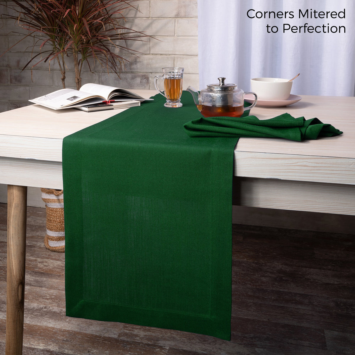 Eden green linen table runner styled on a dining table