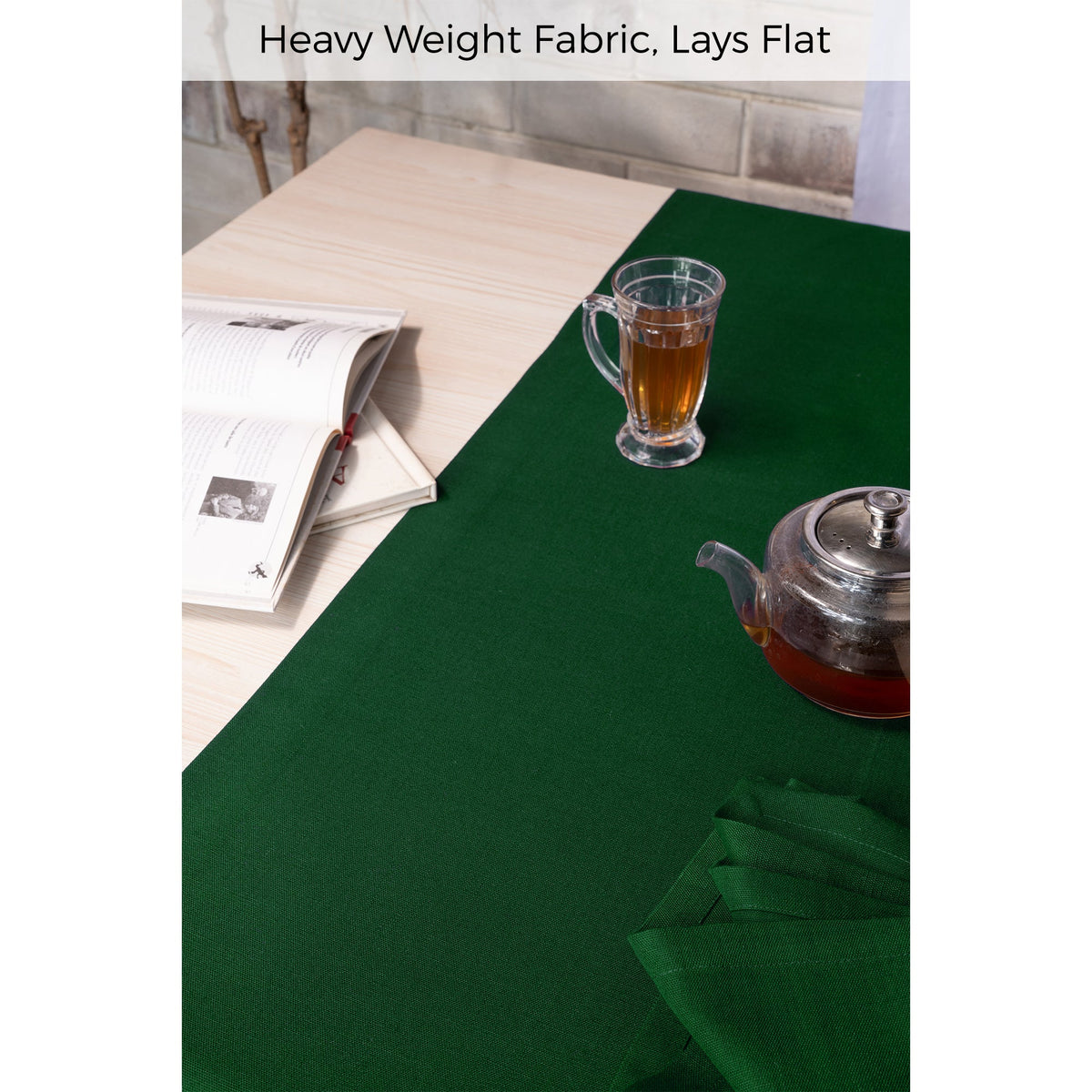 Close-up of the mitered corners on an eden green linen table runner