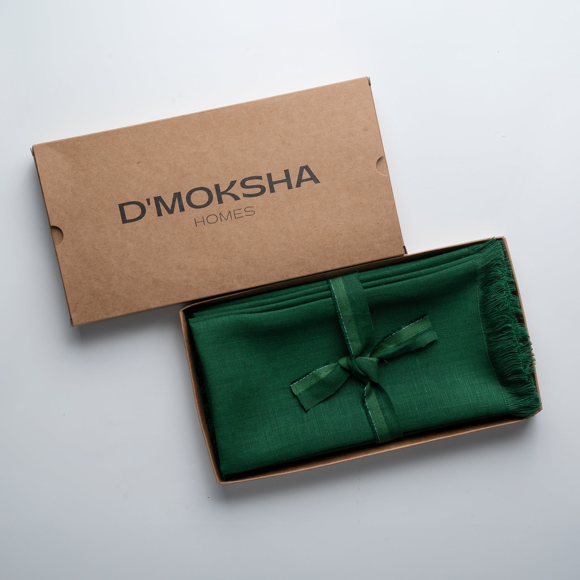 Forest green pure linen dinner napkins in a set table setting