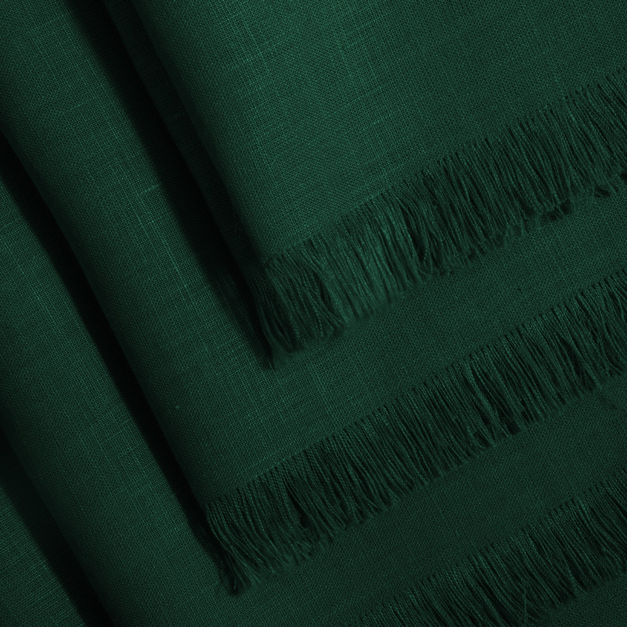 Forest green pure linen dinner napkins folded to show fabric texture