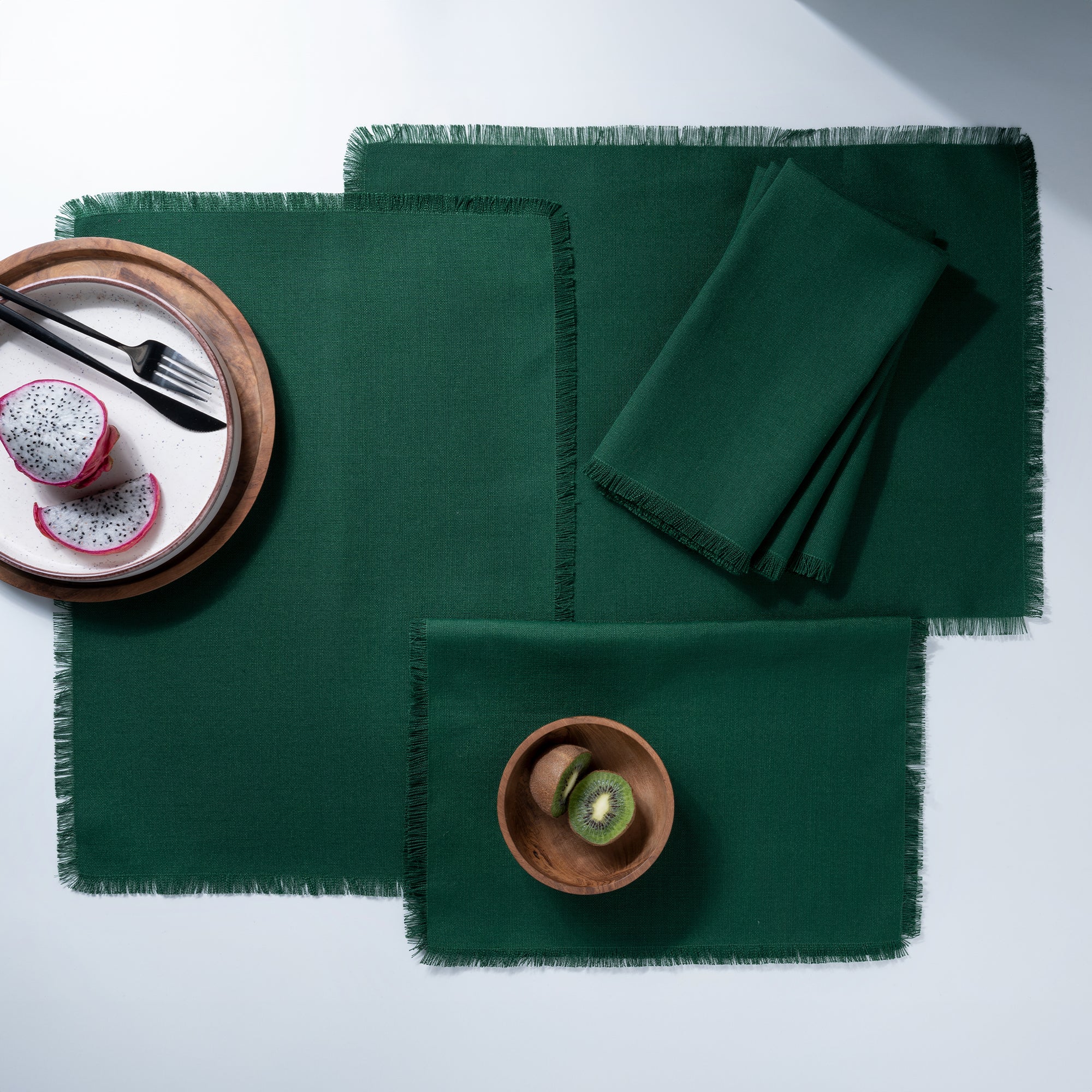 Close-up of the fringed edge on eden green faux linen placemats