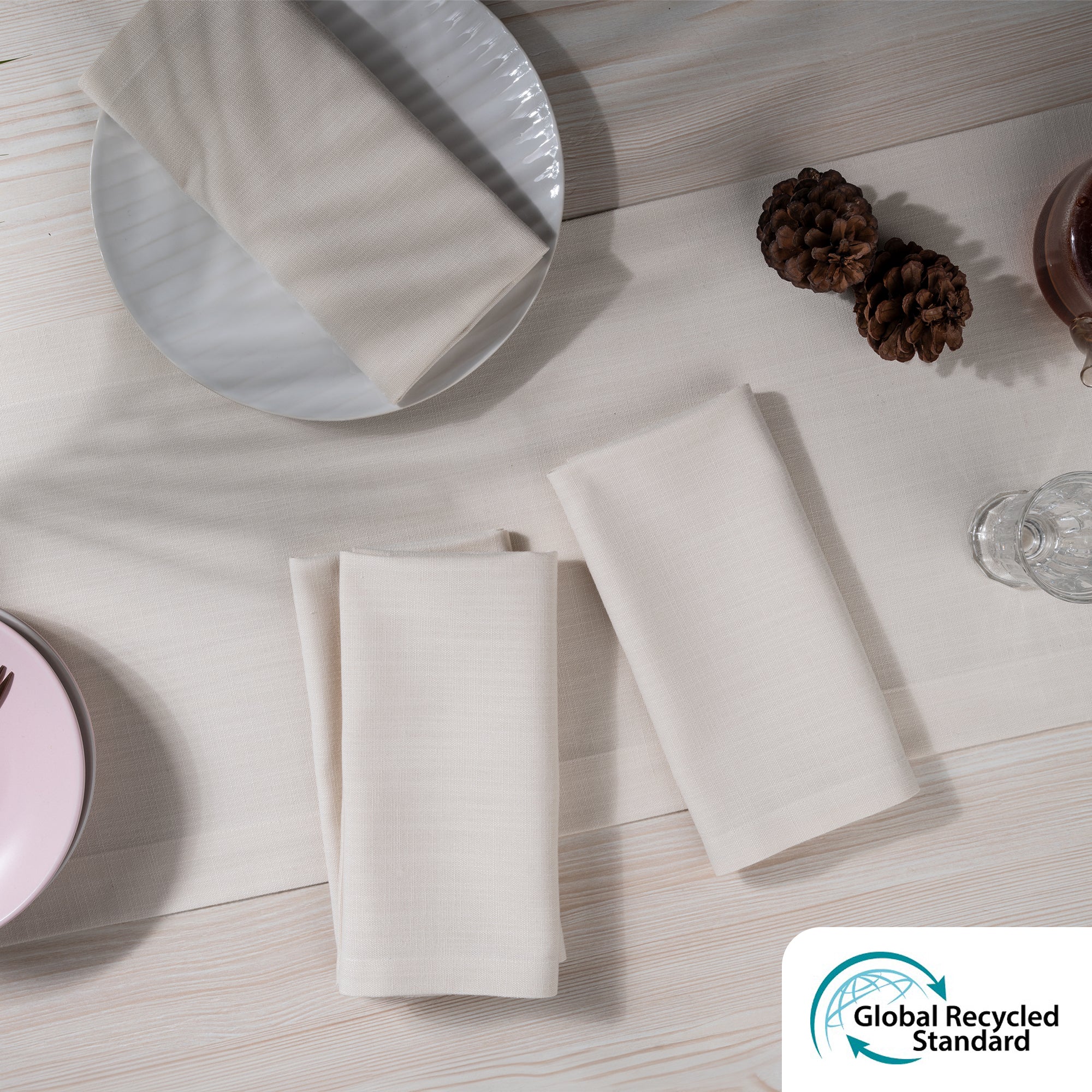 Ivory faux linen dinner napkins styled on a dining table