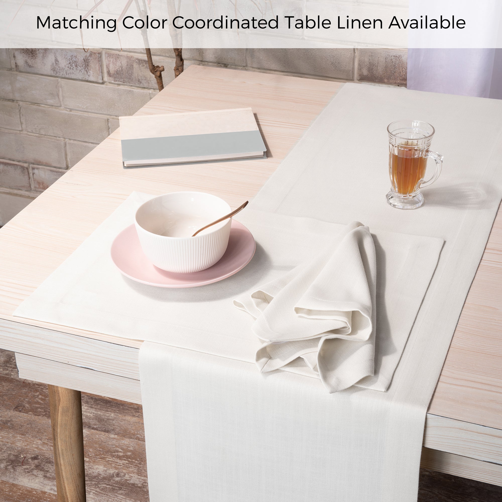 Ivory faux linen dinner napkins folded to show fabric texture