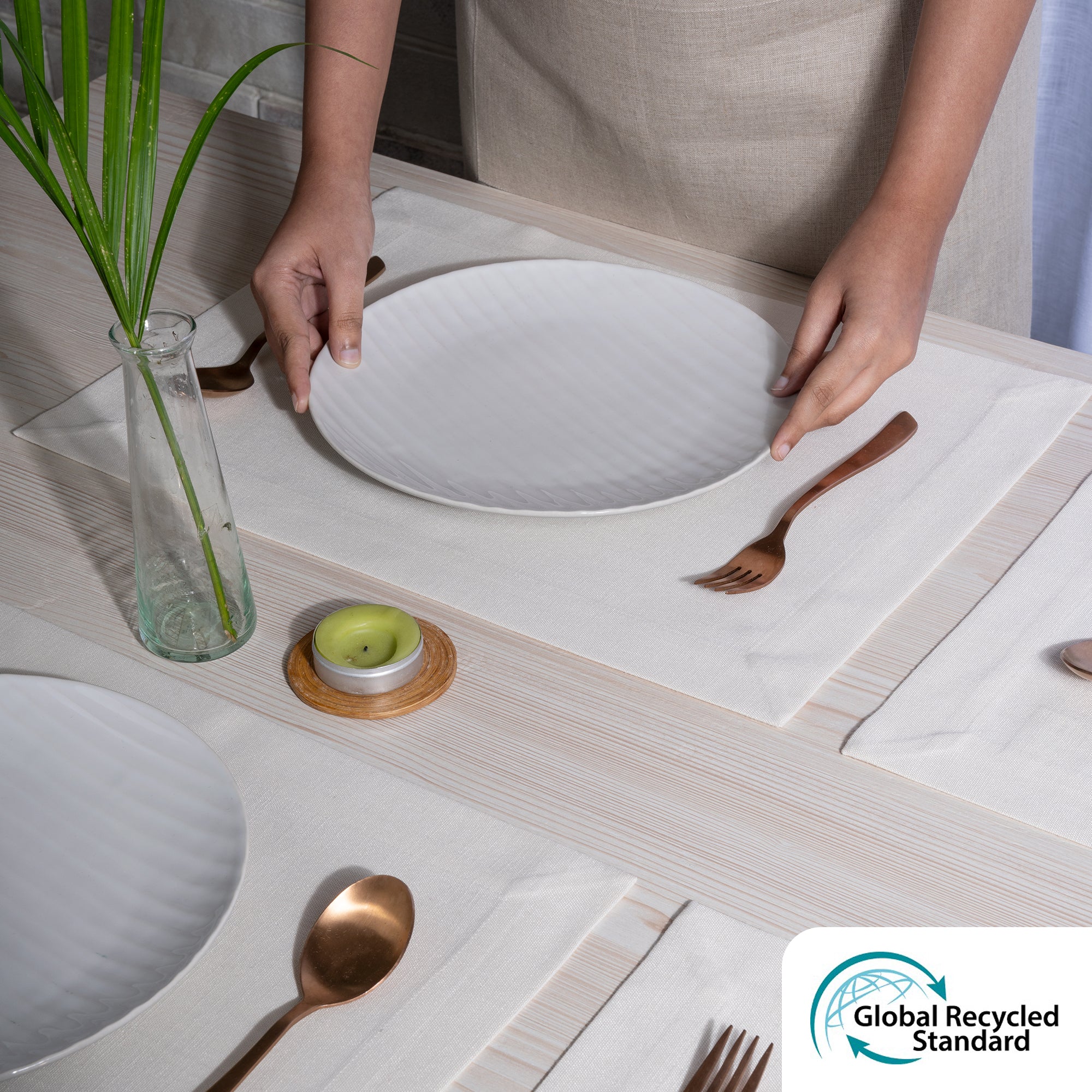 Close-up of the mitered corners on ivory faux linen placemats