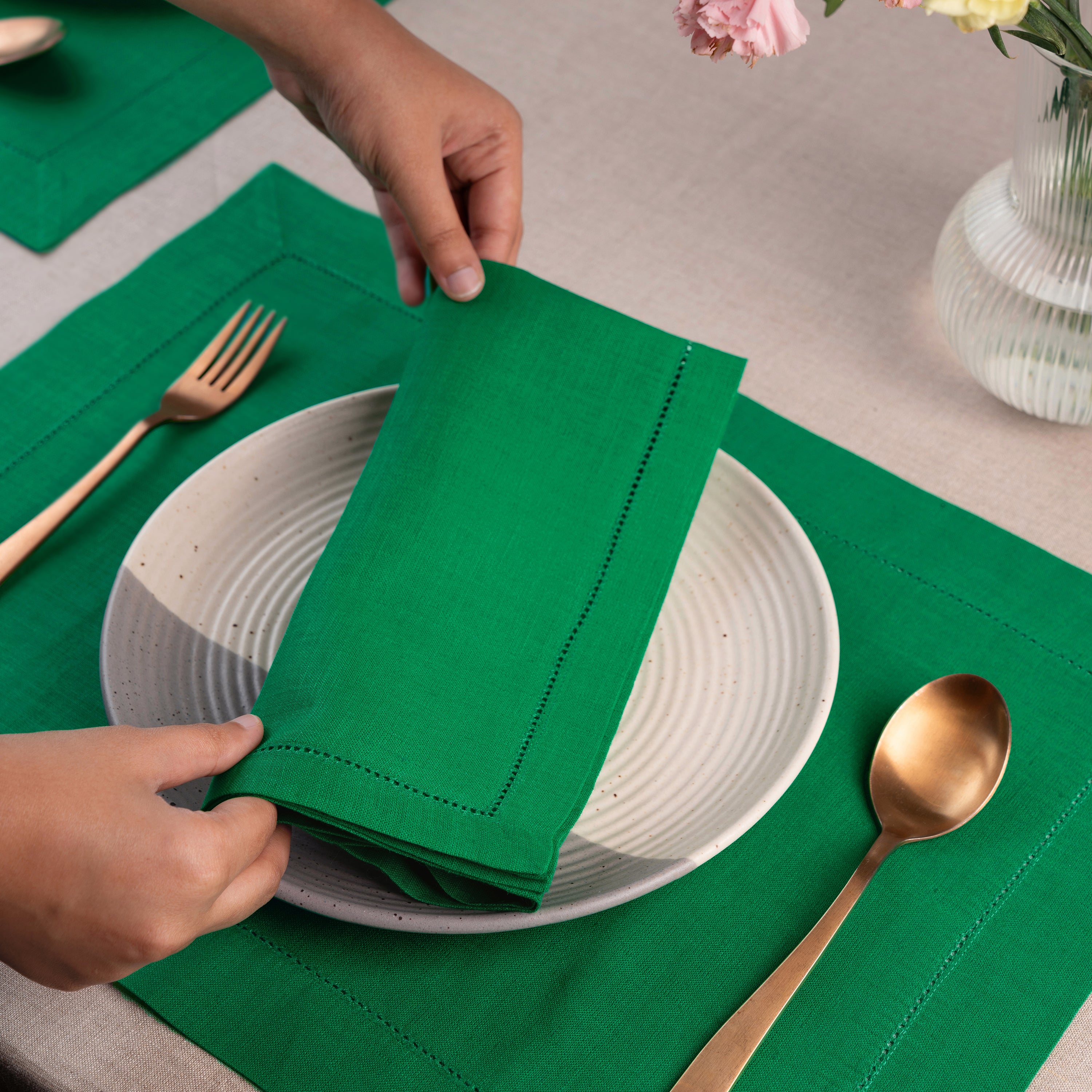 Kelly green pure linen dinner napkins styled on a dining table