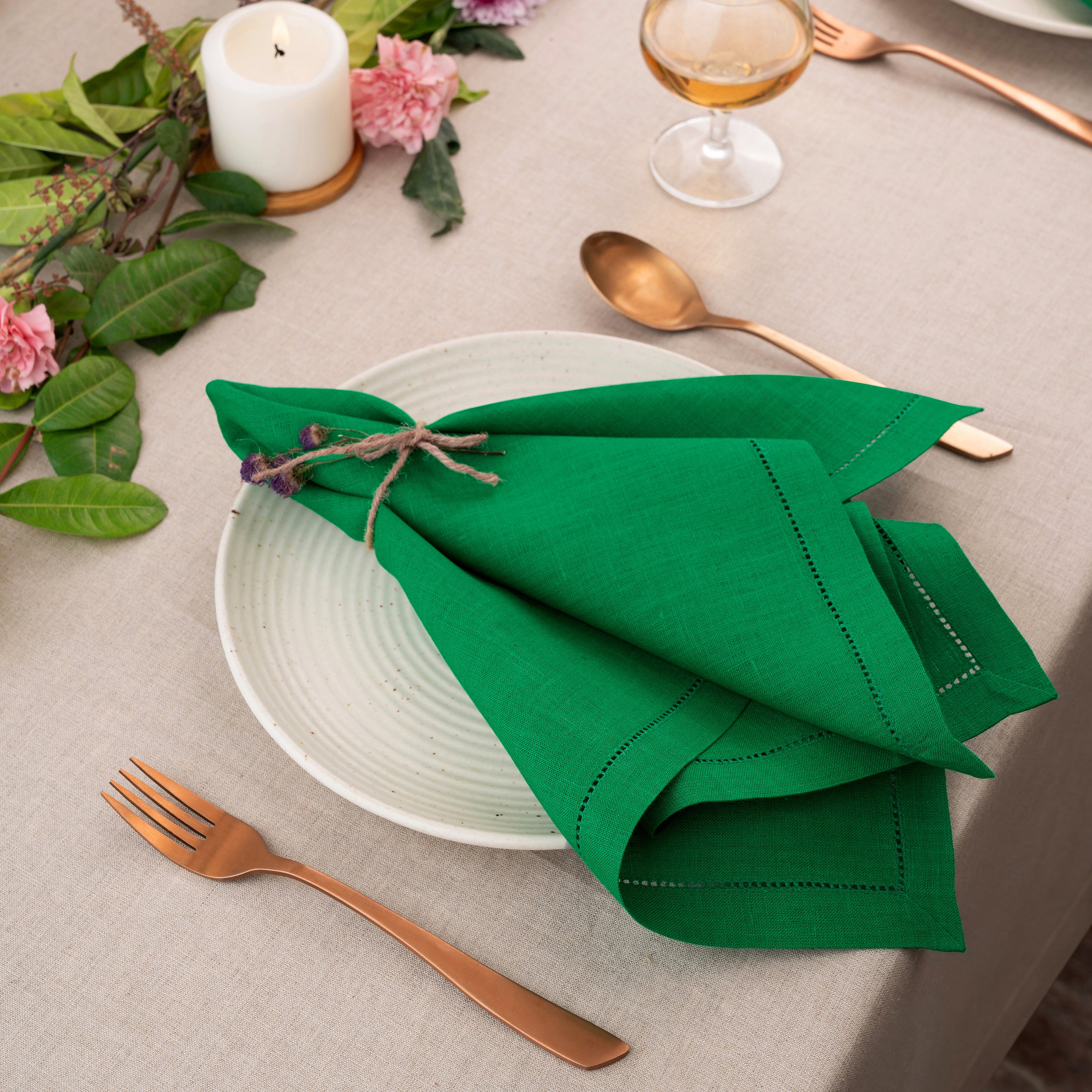 Close-up of the hemstitch edge on kelly green pure linen dinner napkins