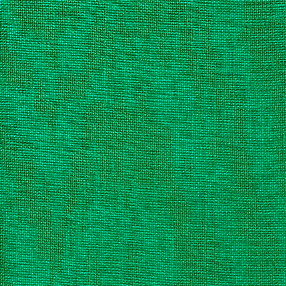 Kelly green pure linen dinner napkins styled on a dining table