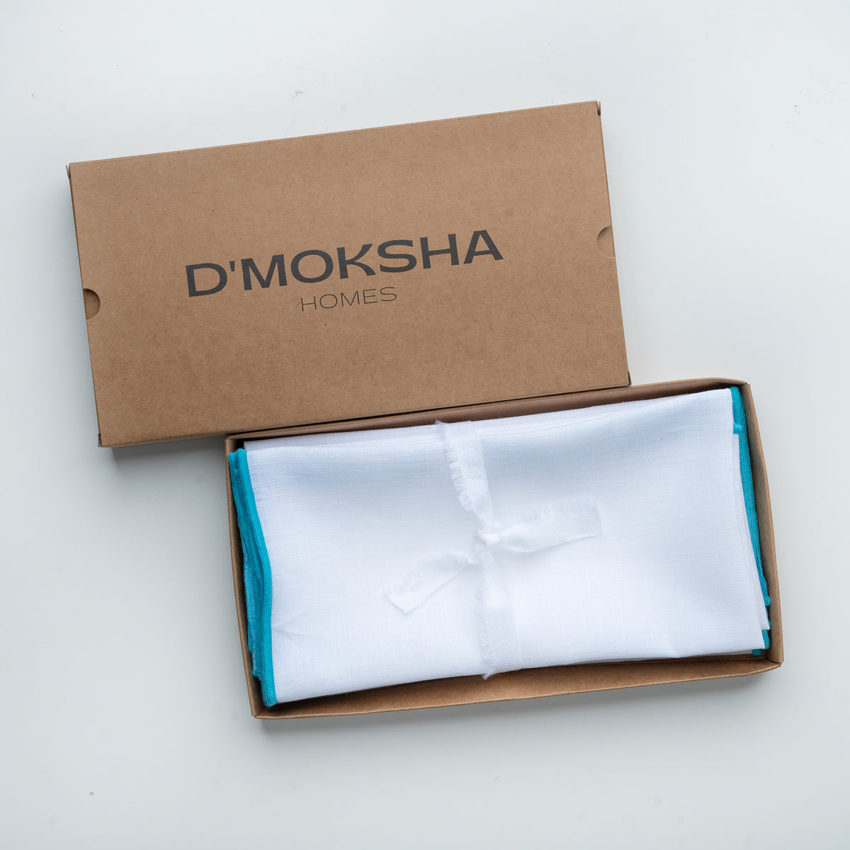 White and blue pure linen dinner napkins in a set table setting