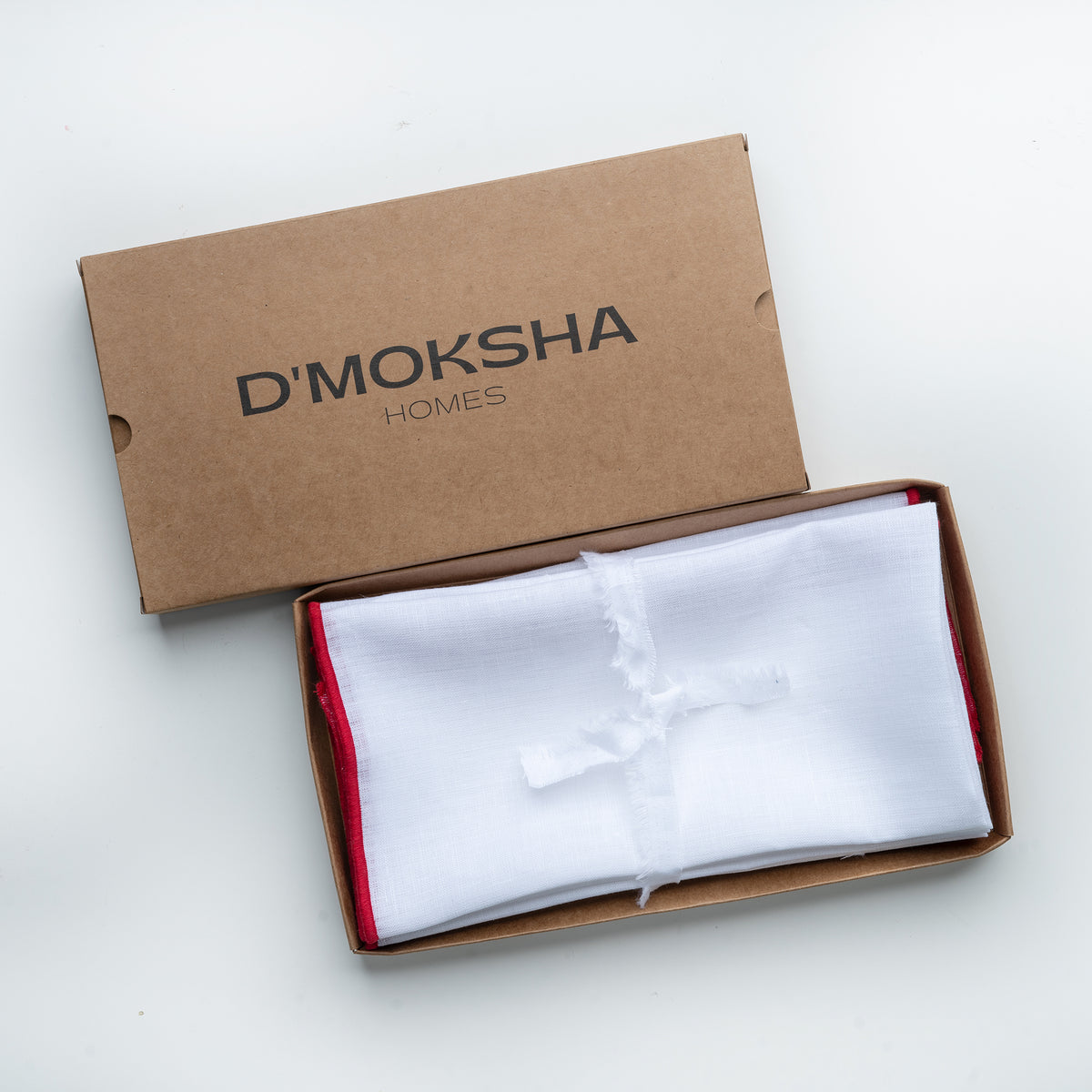 White and red pure linen dinner napkins in a set table setting