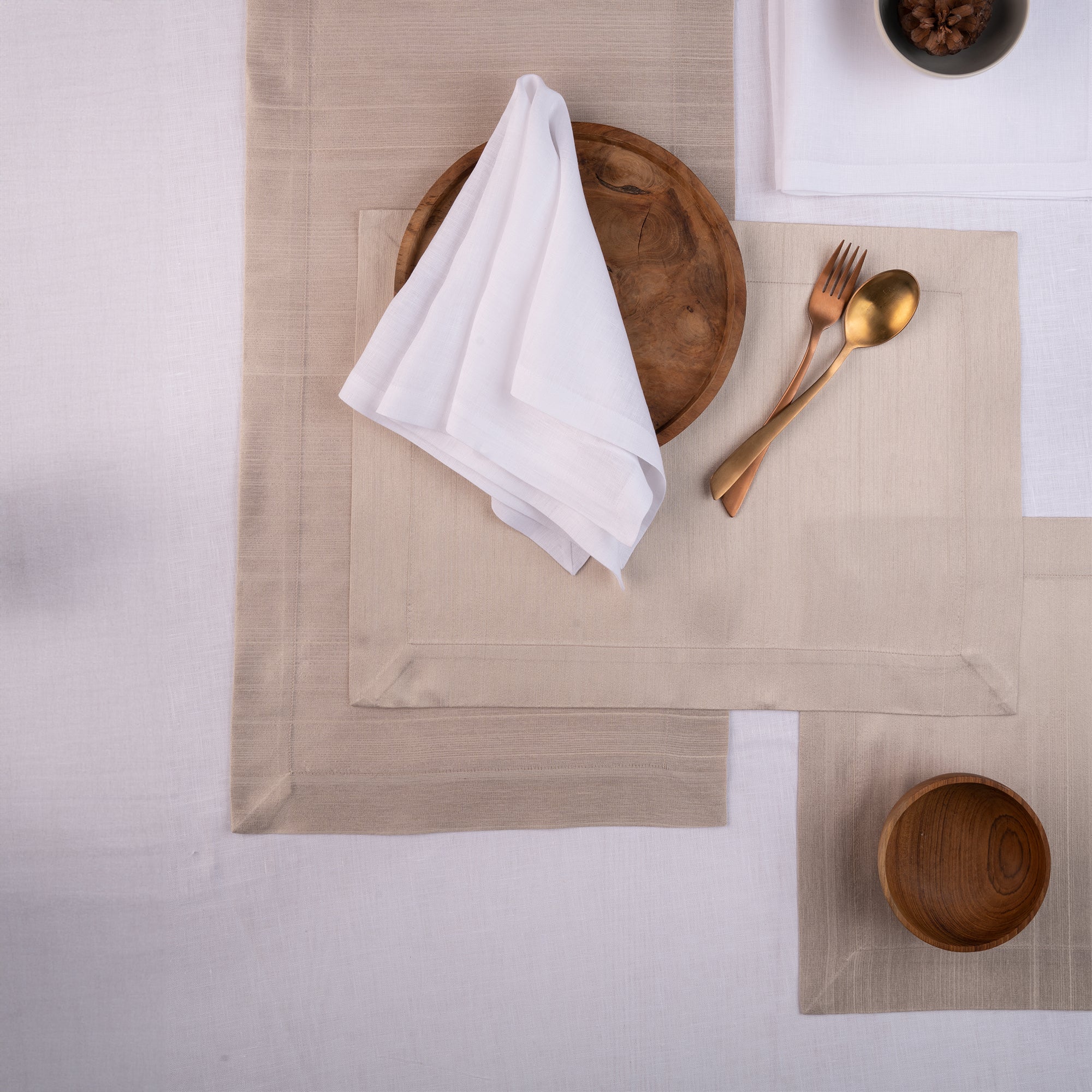 Close-up of the mitered corners on natural Luxe Shine placemats