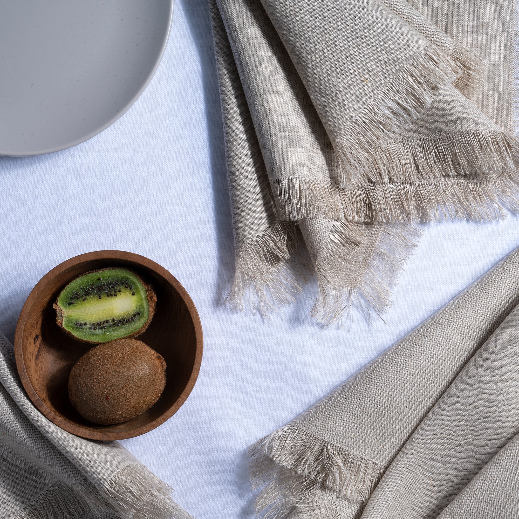 Close-up of the fringed edge on natural pure linen dinner napkins