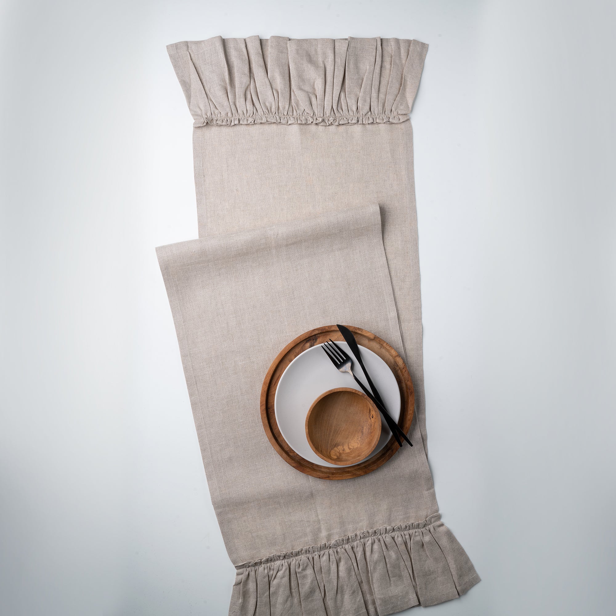 Natural pure linen table runner folded to show fabric texture