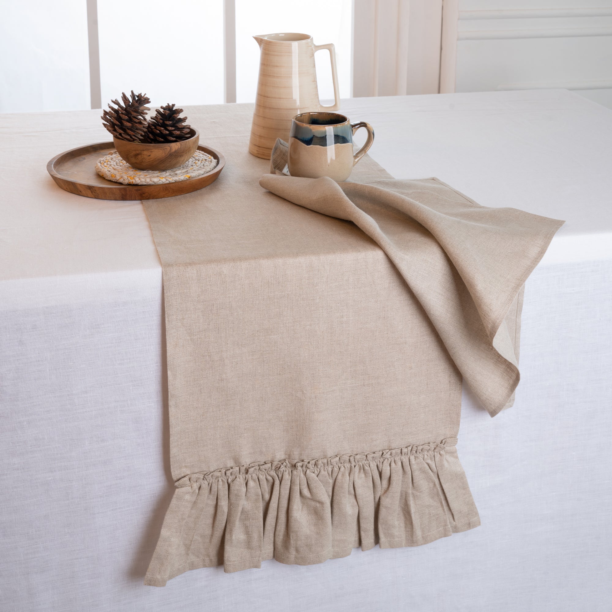 Natural pure linen table runner styled on a dining table