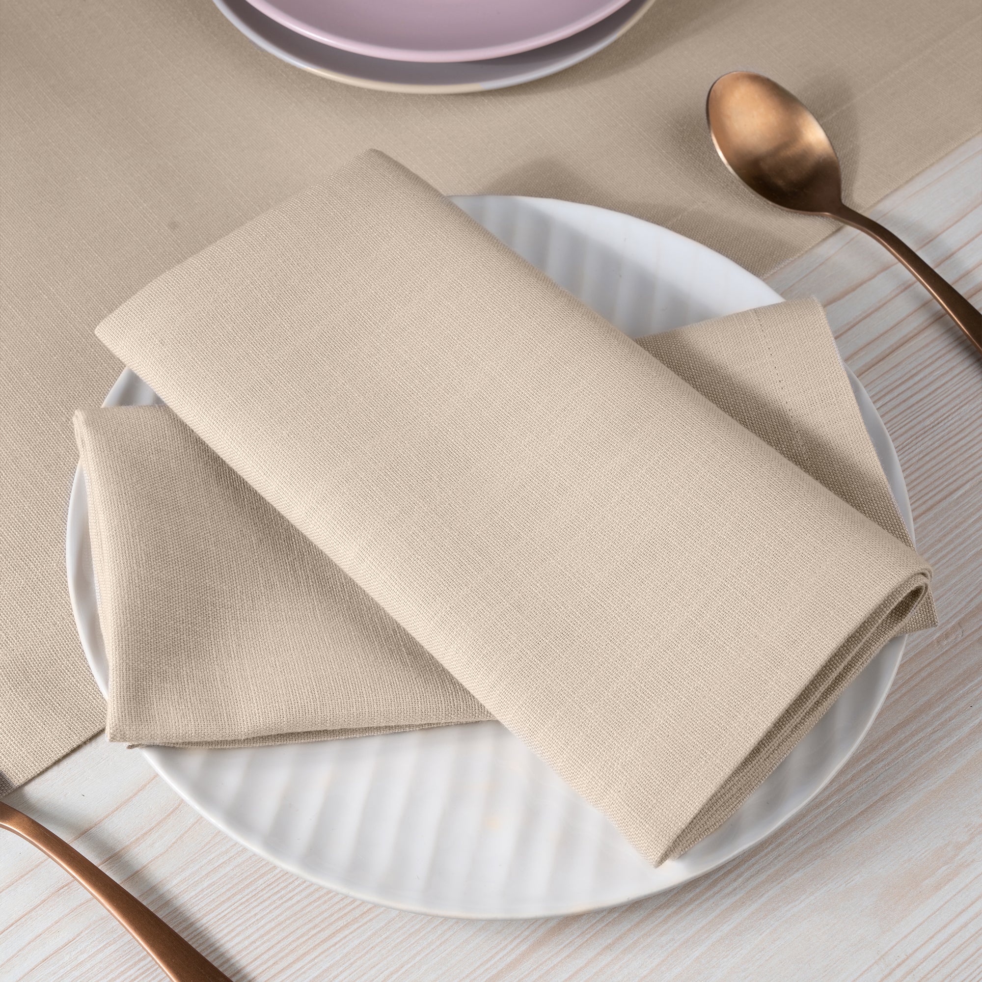 Natural faux linen dinner napkins with matching D'Moksha table linens
