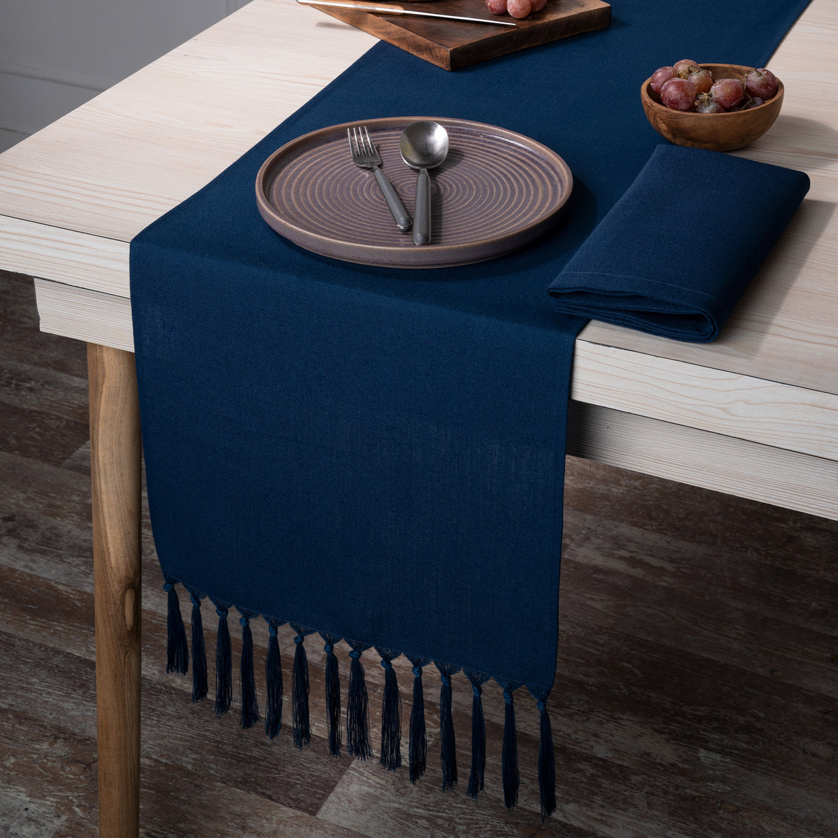 Navy blue faux linen table runner styled on a dining table