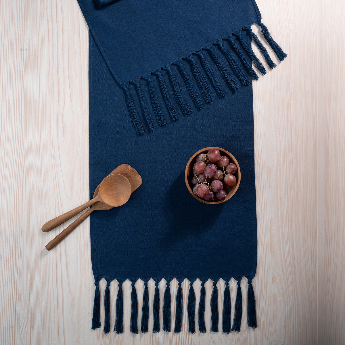 Navy blue faux linen table runner with matching D'Moksha table linens