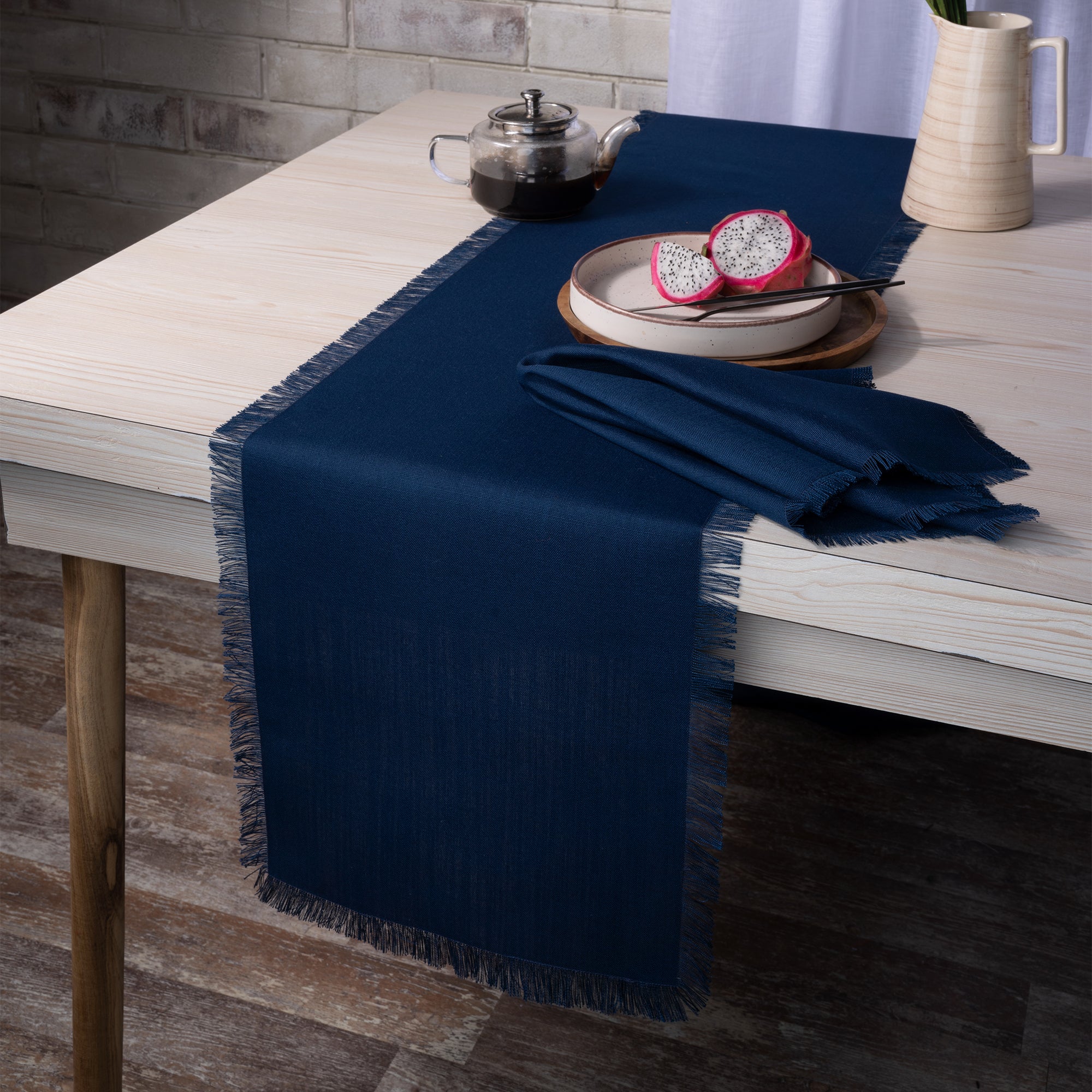 Navy blue faux linen table runner styled on a dining table