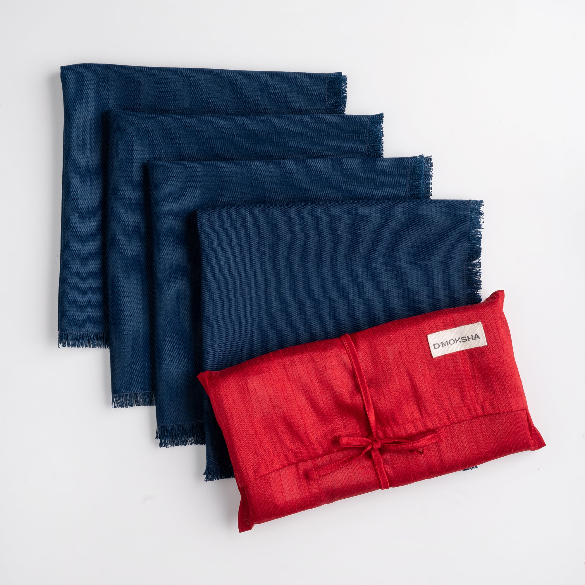 Navy blue faux linen dinner napkins folded to show fabric texture