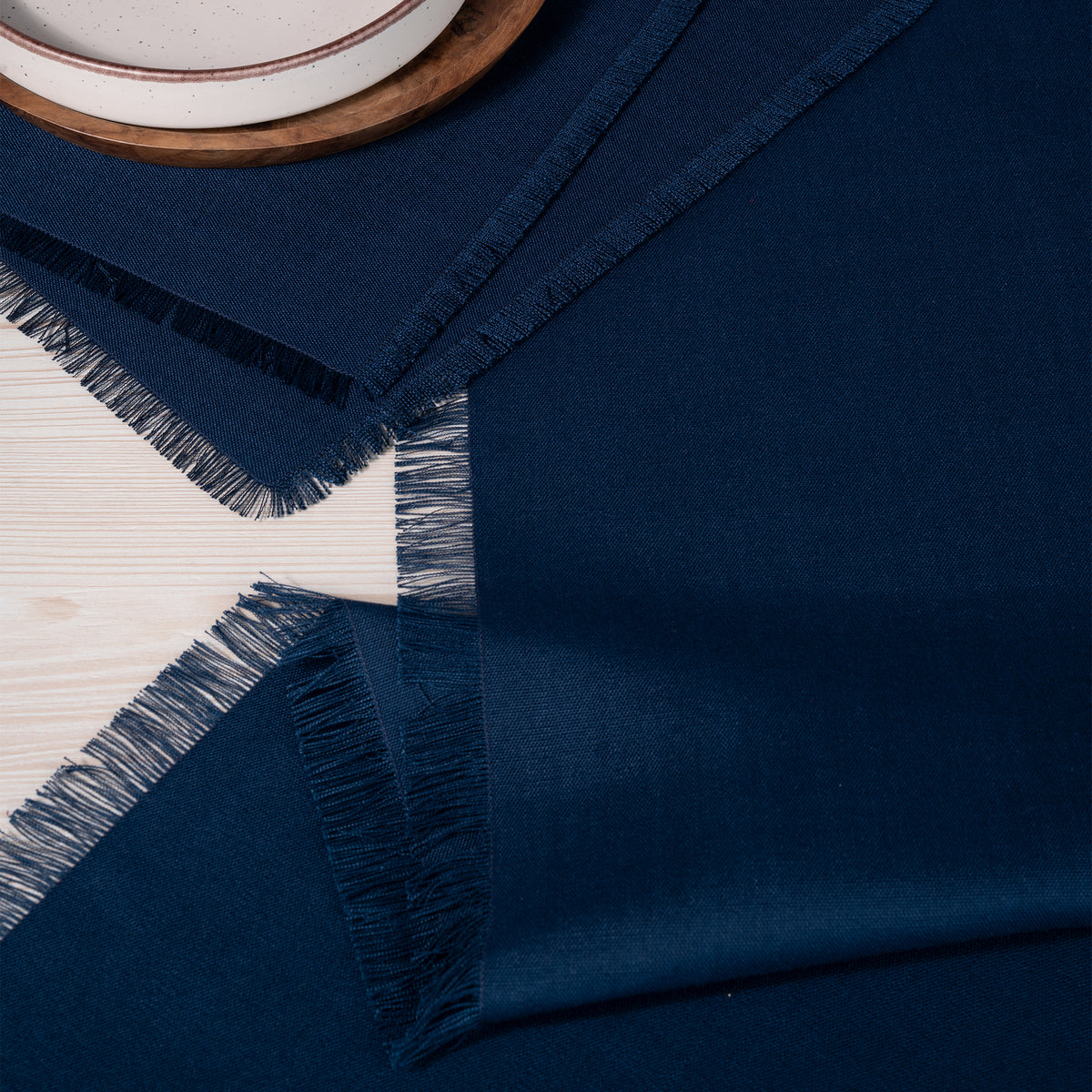 Navy blue faux linen table runner with matching D'Moksha table linens