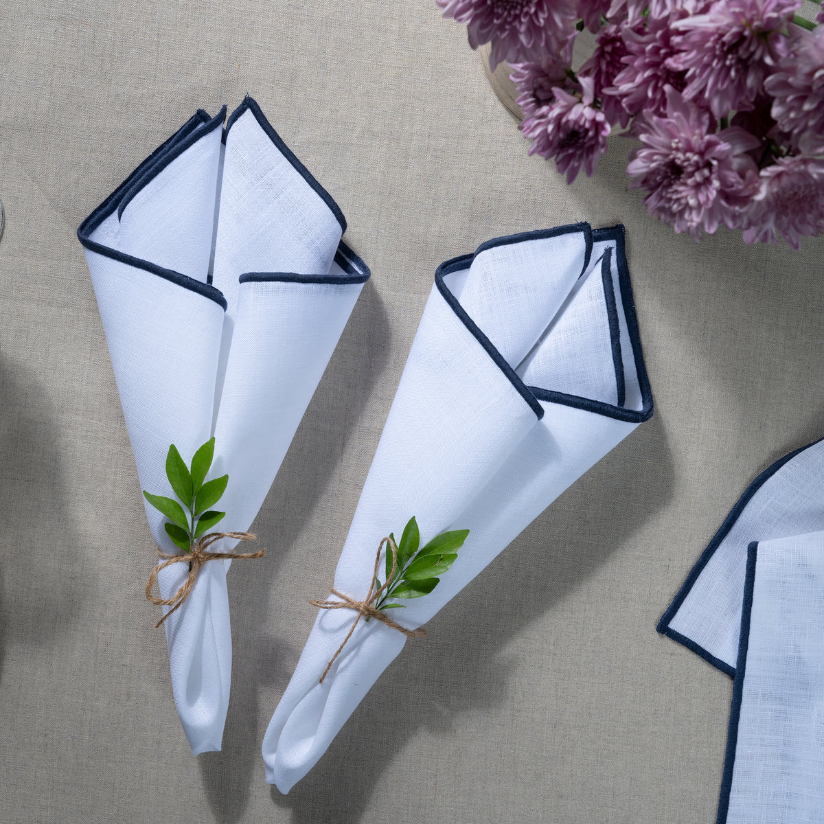 White and navy blue pure linen dinner napkins with matching D'Moksha table linens