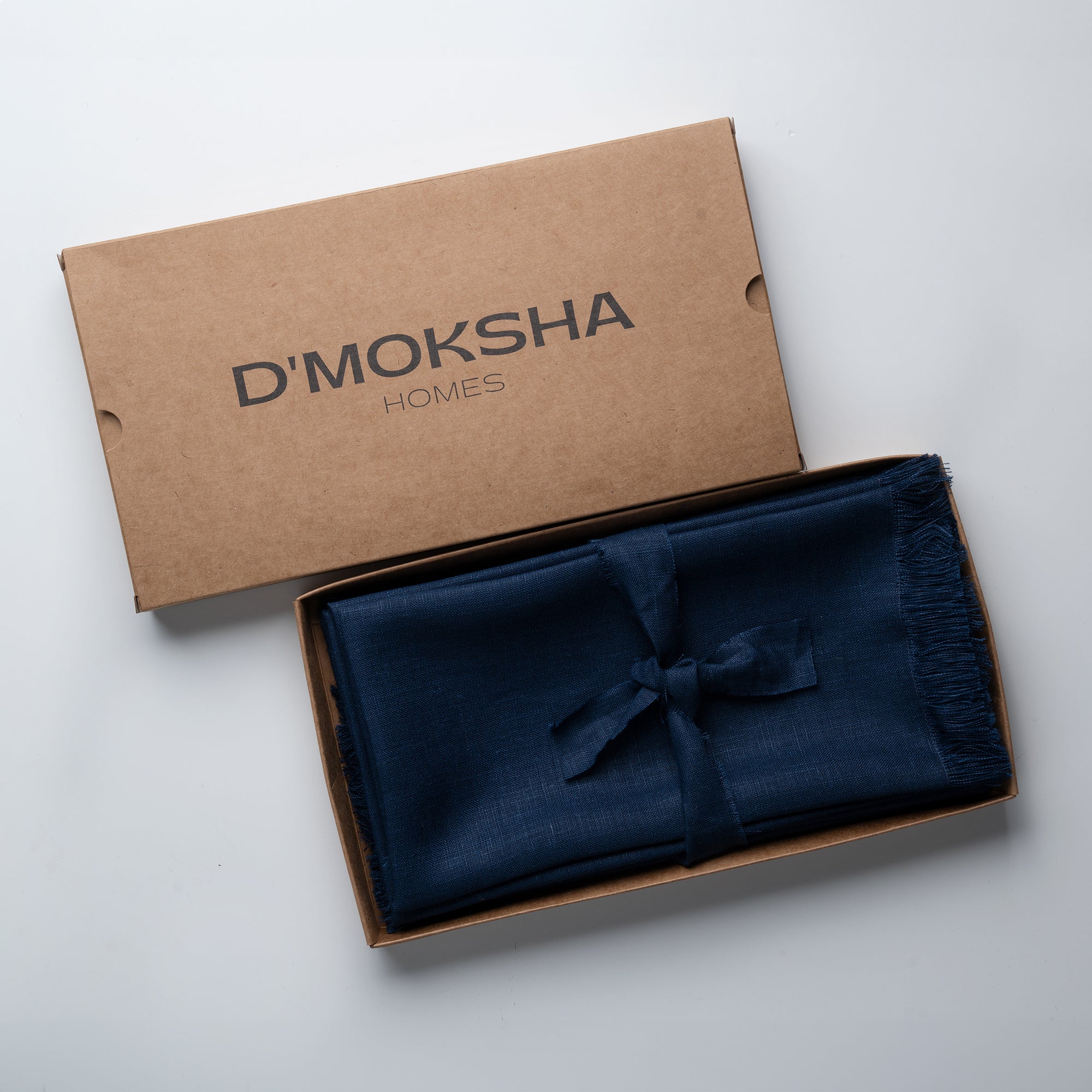 Navy blue pure linen dinner napkins in a set table setting