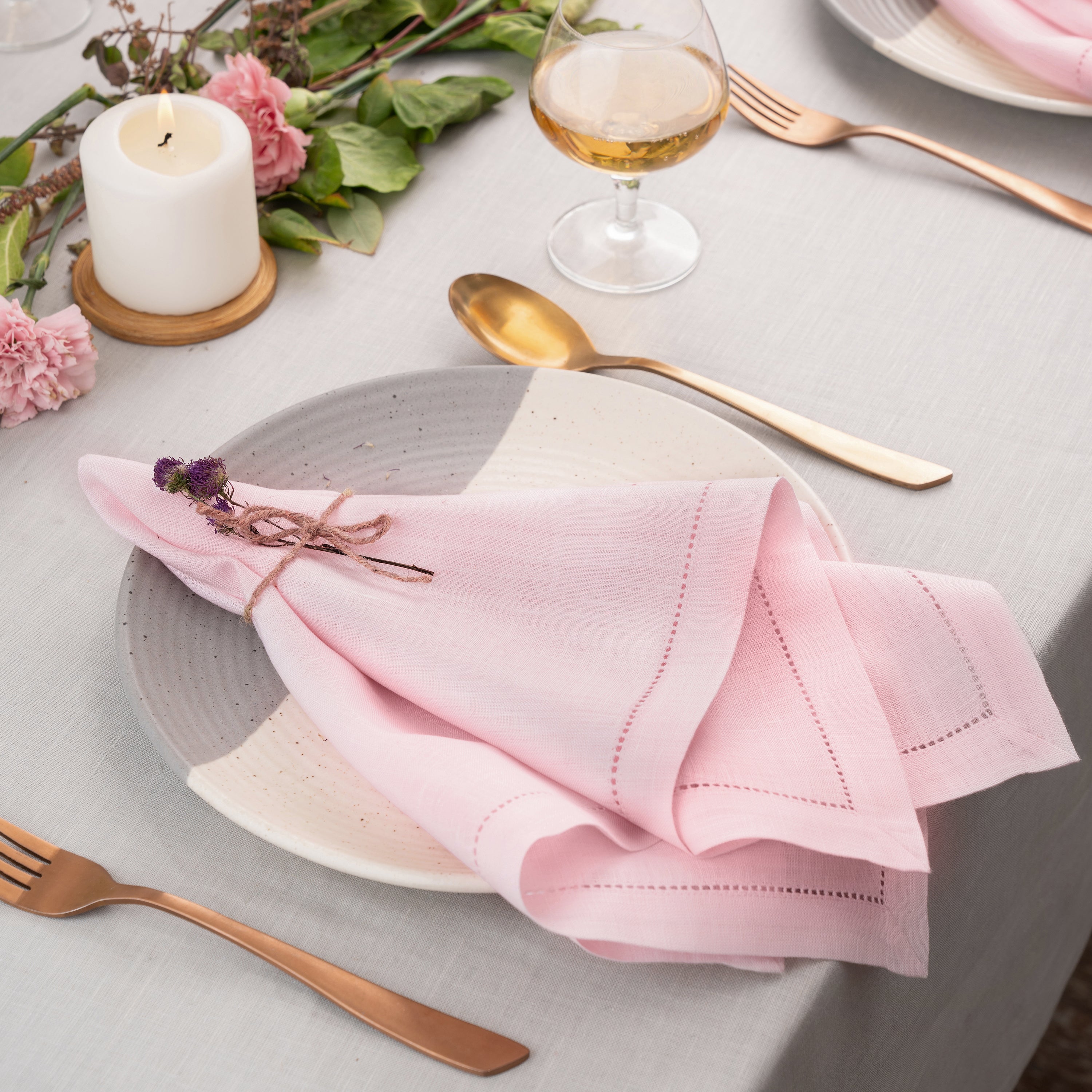 Close-up of the hemstitch edge on pastel pink pure linen dinner napkins